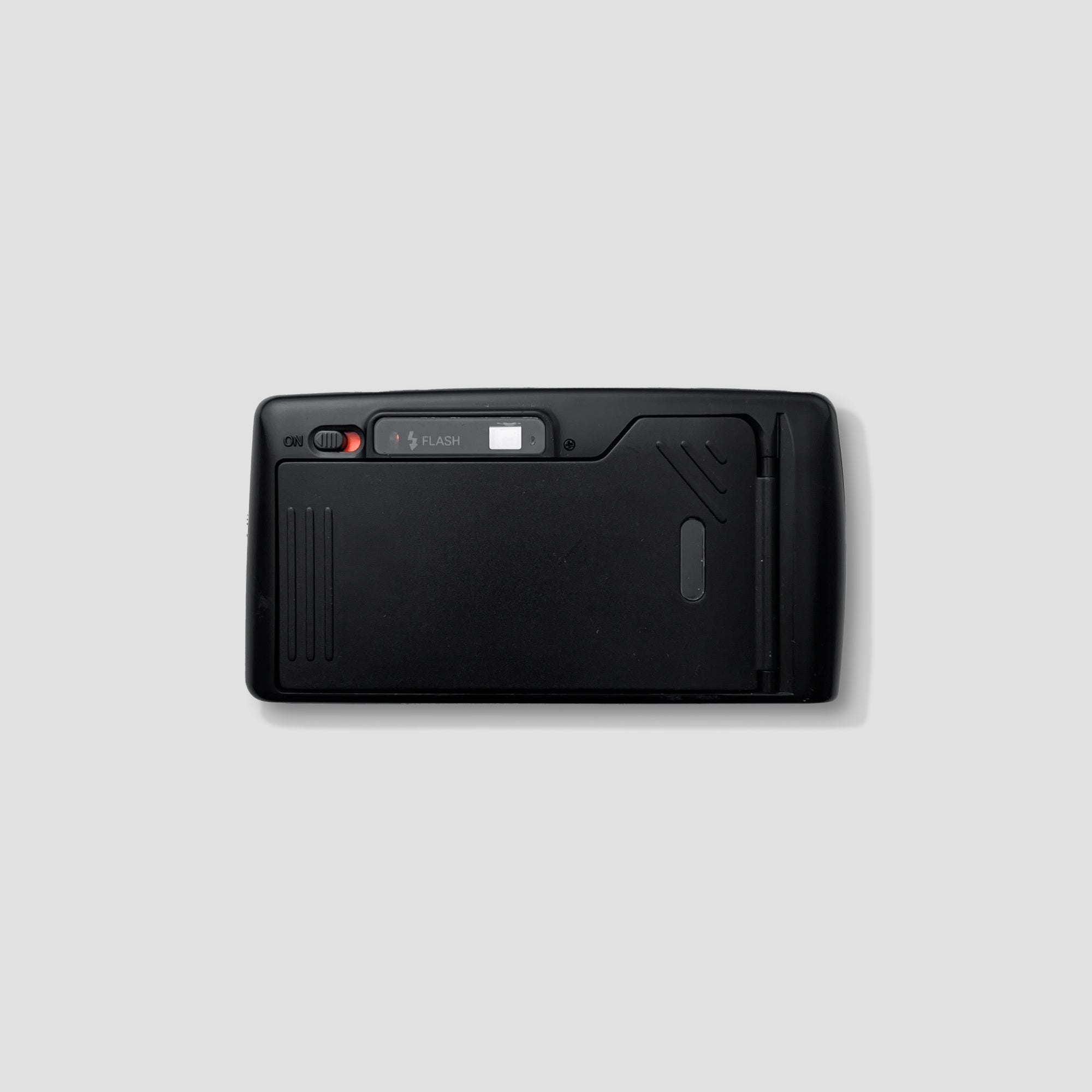 Photographer holding Ricoh L-20 camera for street photography