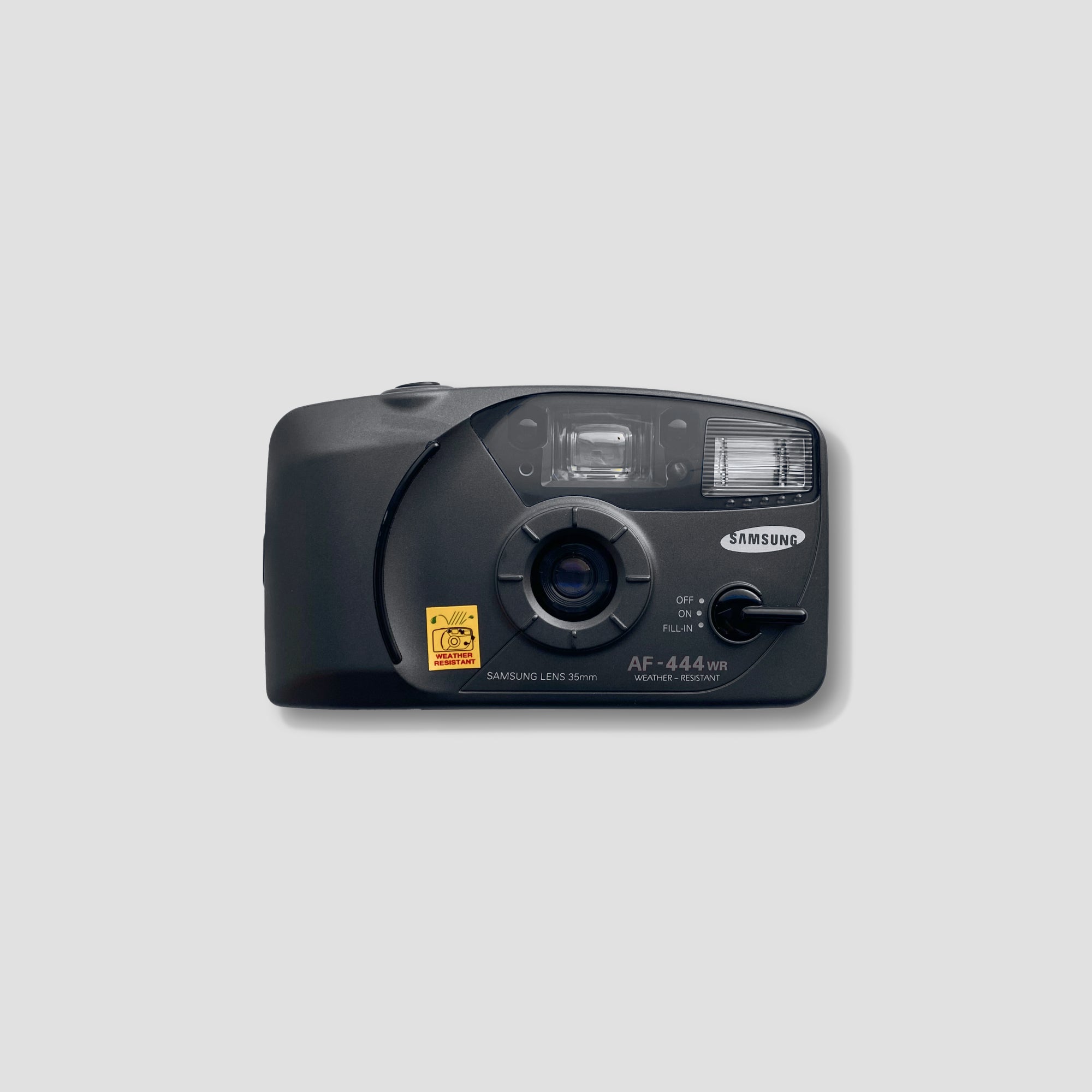 Close-up of the Samsung AF 444WR vintage camera showing weatherproof casing
