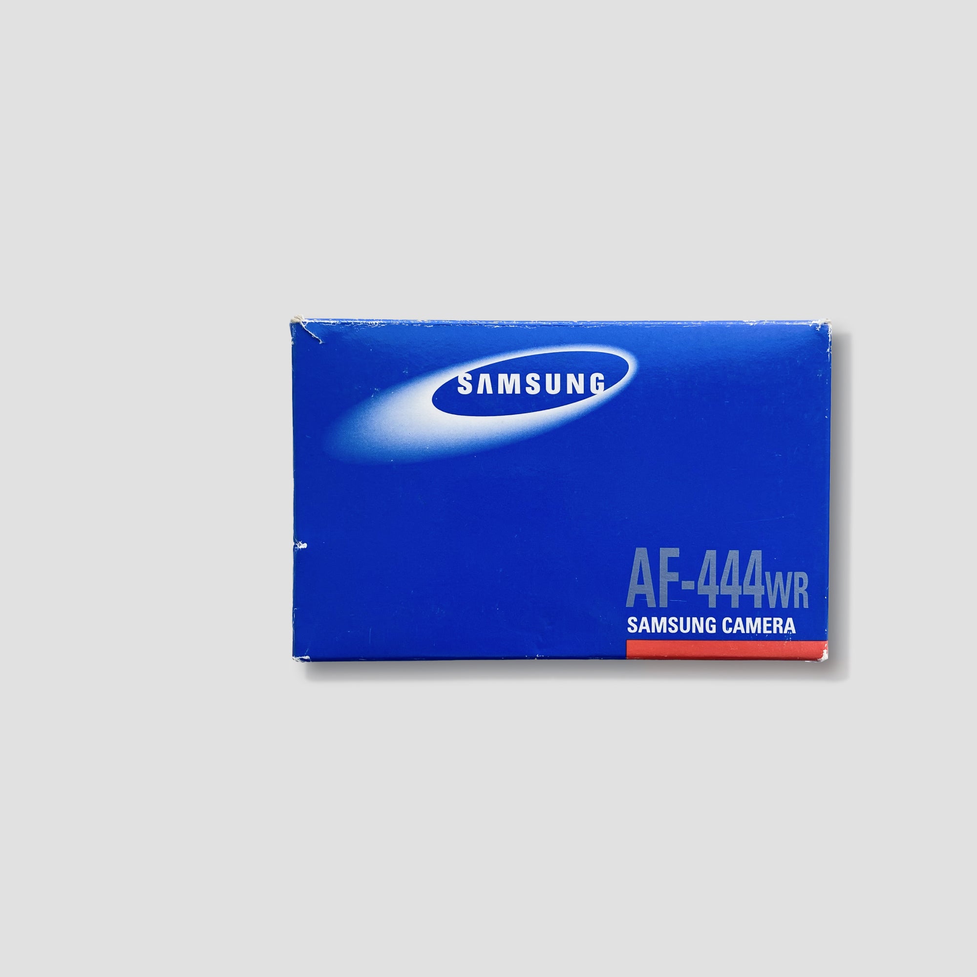 Close-up of the Samsung AF 444WR vintage camera showing weatherproof casing