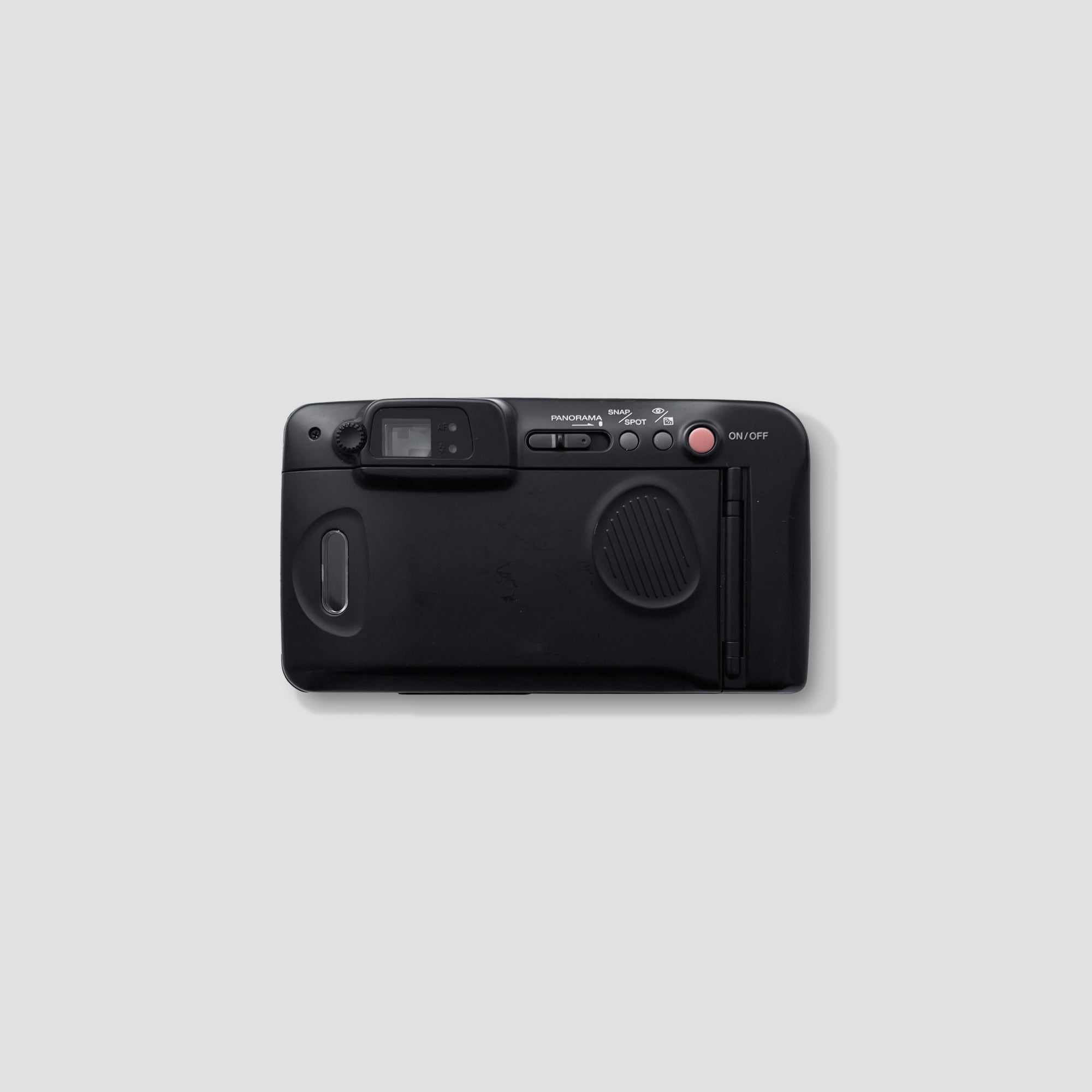 User holding the Samsung Slim Zoom 145 Panorama camera while taking photos outdoors