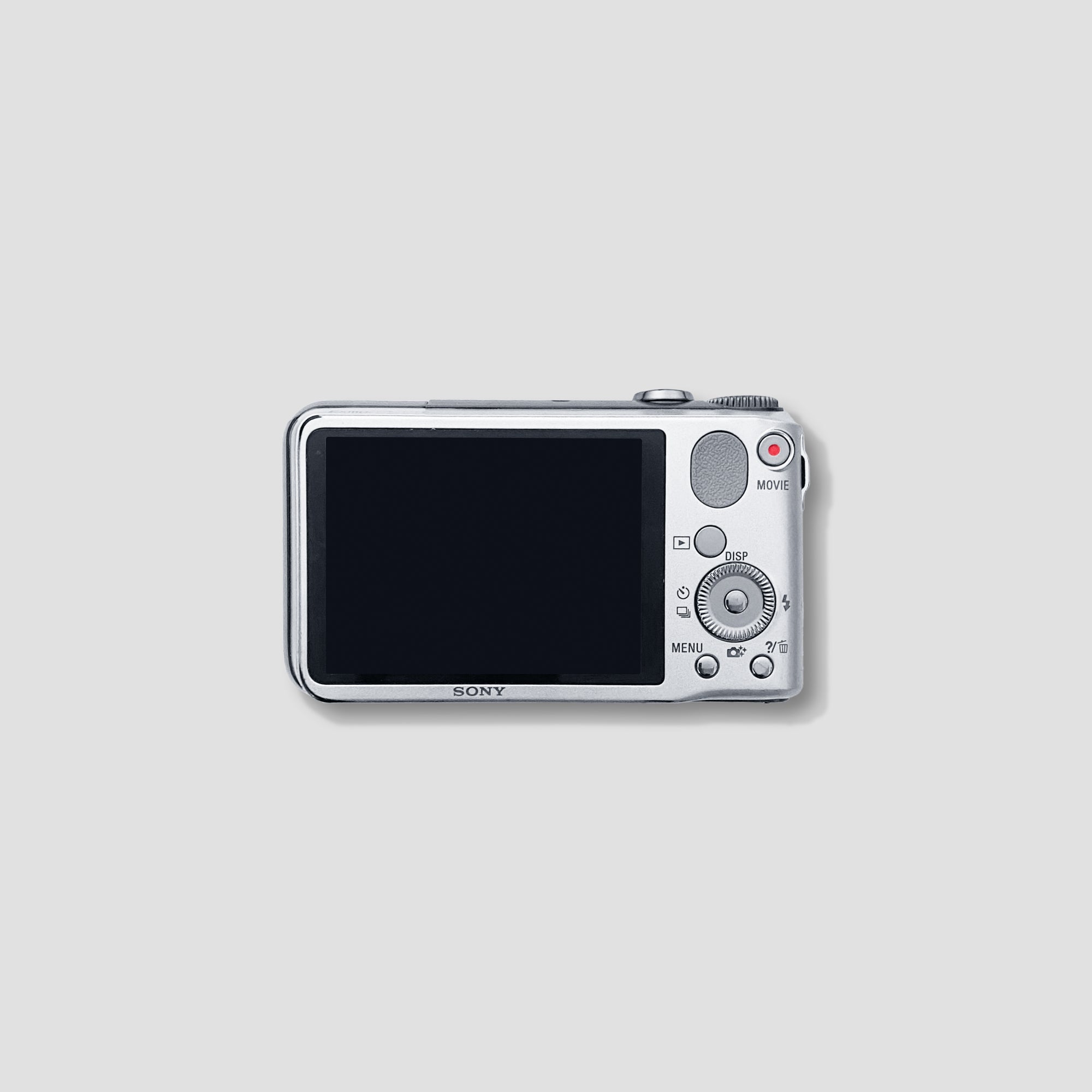 Travel photographer holding Sony compact camera with GPS feature