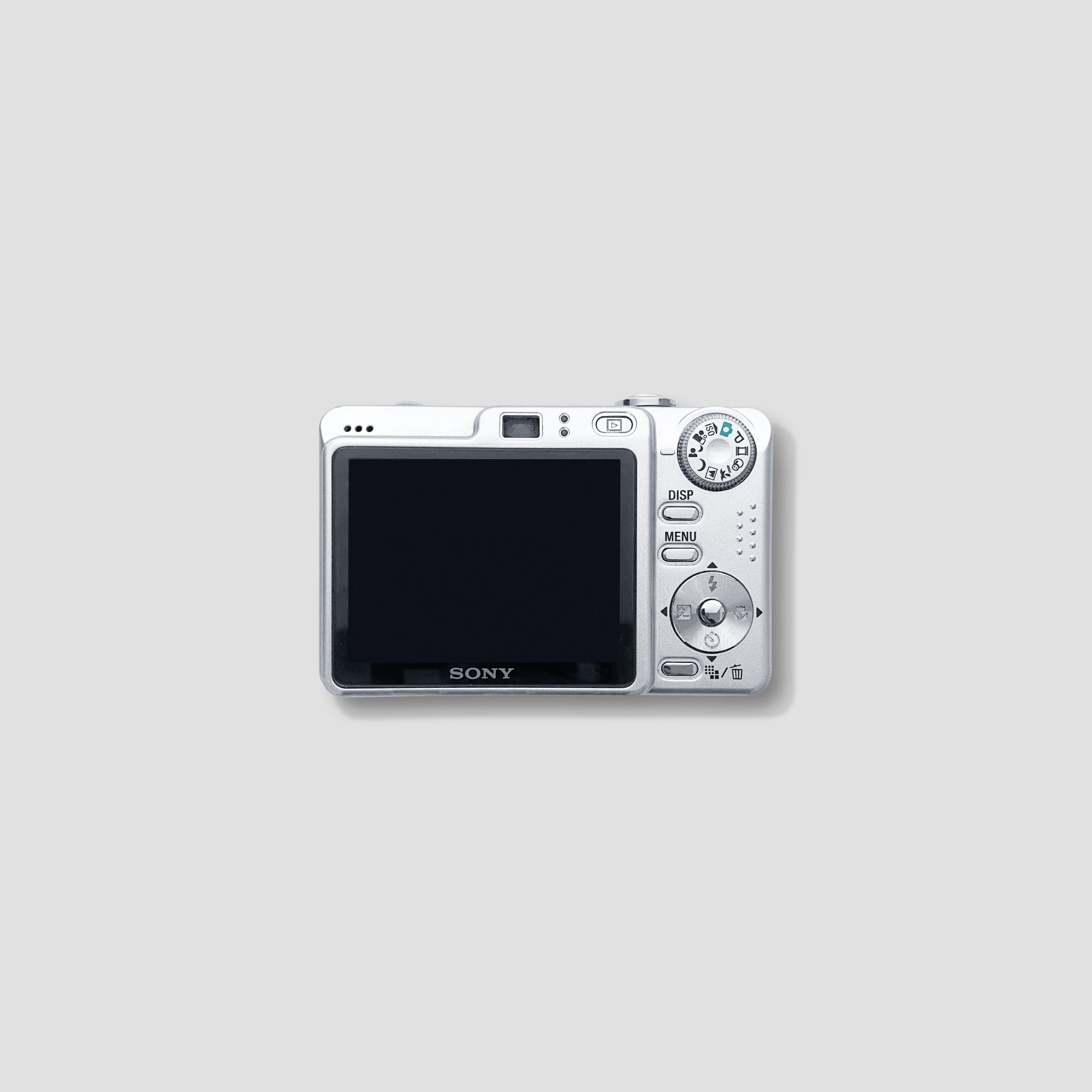 Close-up of Sony Cybershot DSC-W55 with a scenic background, perfect for travel photography