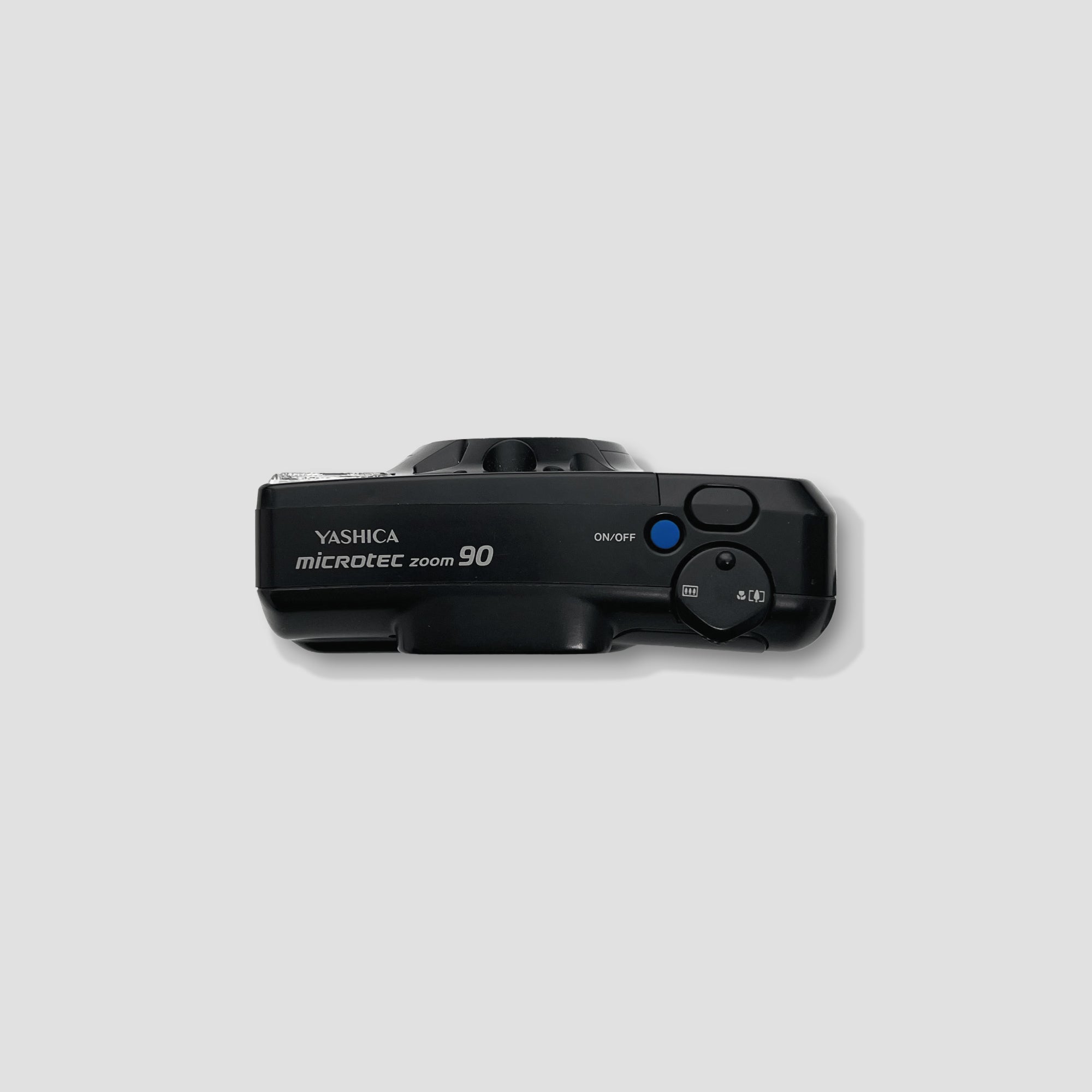 Person holding Yashica Microtec Zoom 90 for outdoor photography