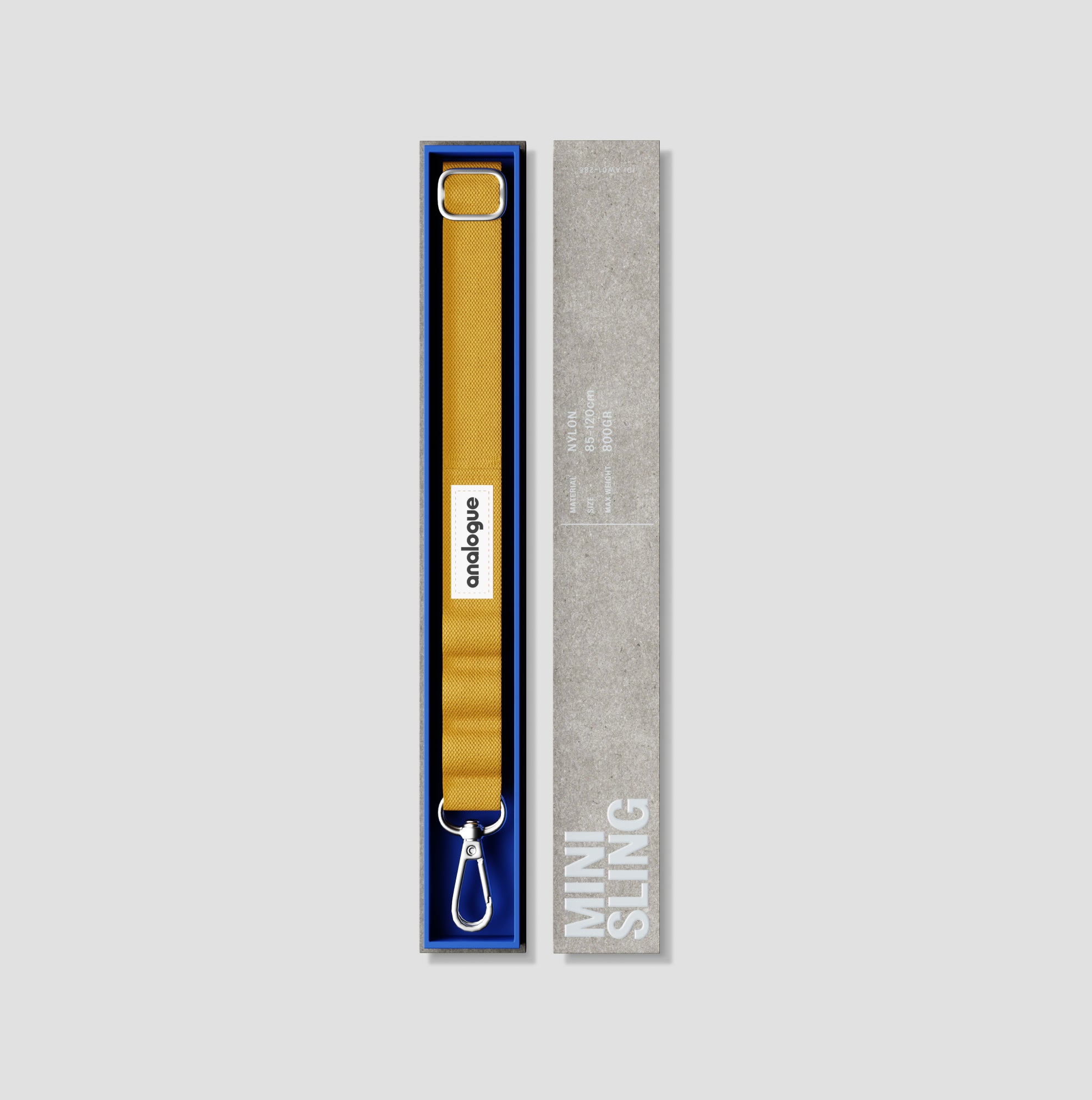 Close-up of yellow camera strap with alloy hook for small cameras