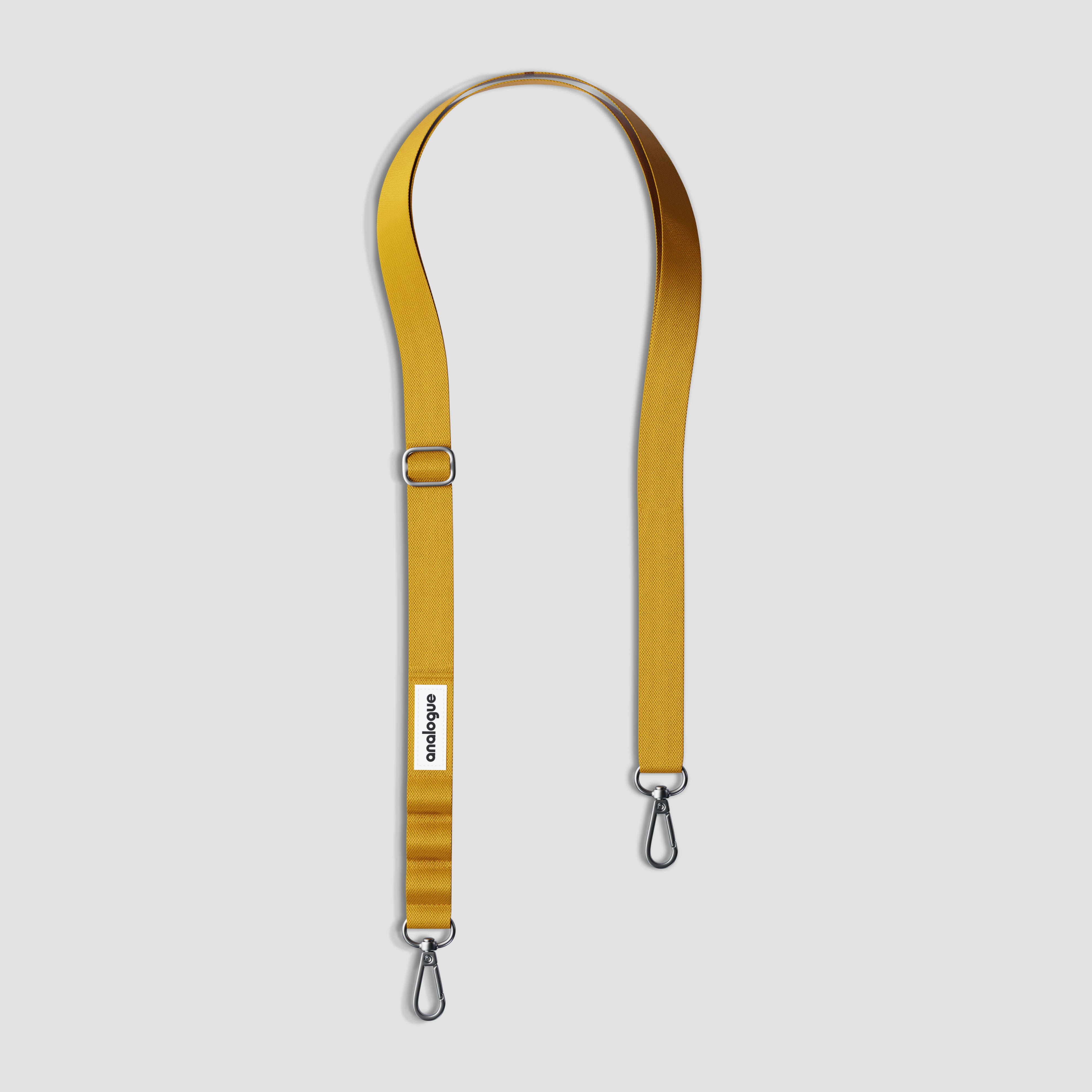 Close-up of yellow camera strap with alloy hook for small cameras