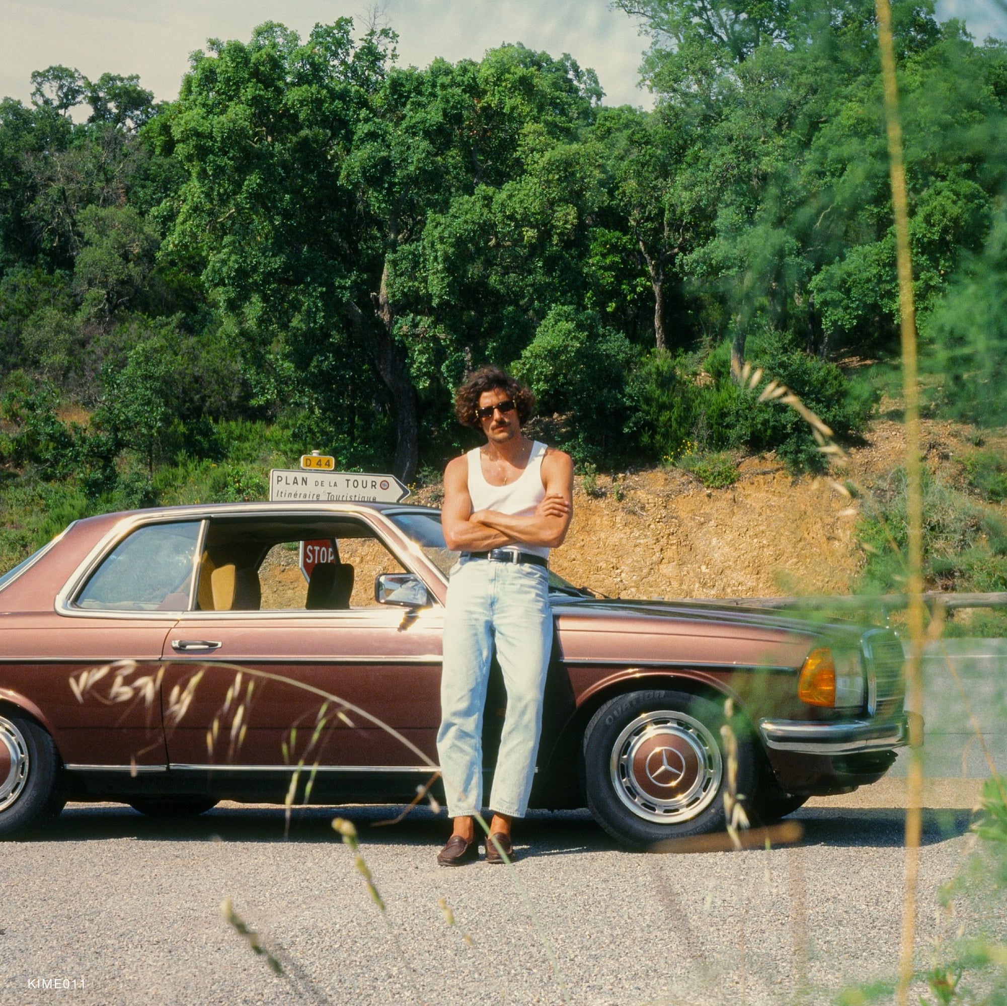 A photographer using Kodak Ektachrome E100 film to capture a stunning landscape, emphasizing the films professional-grade quality.