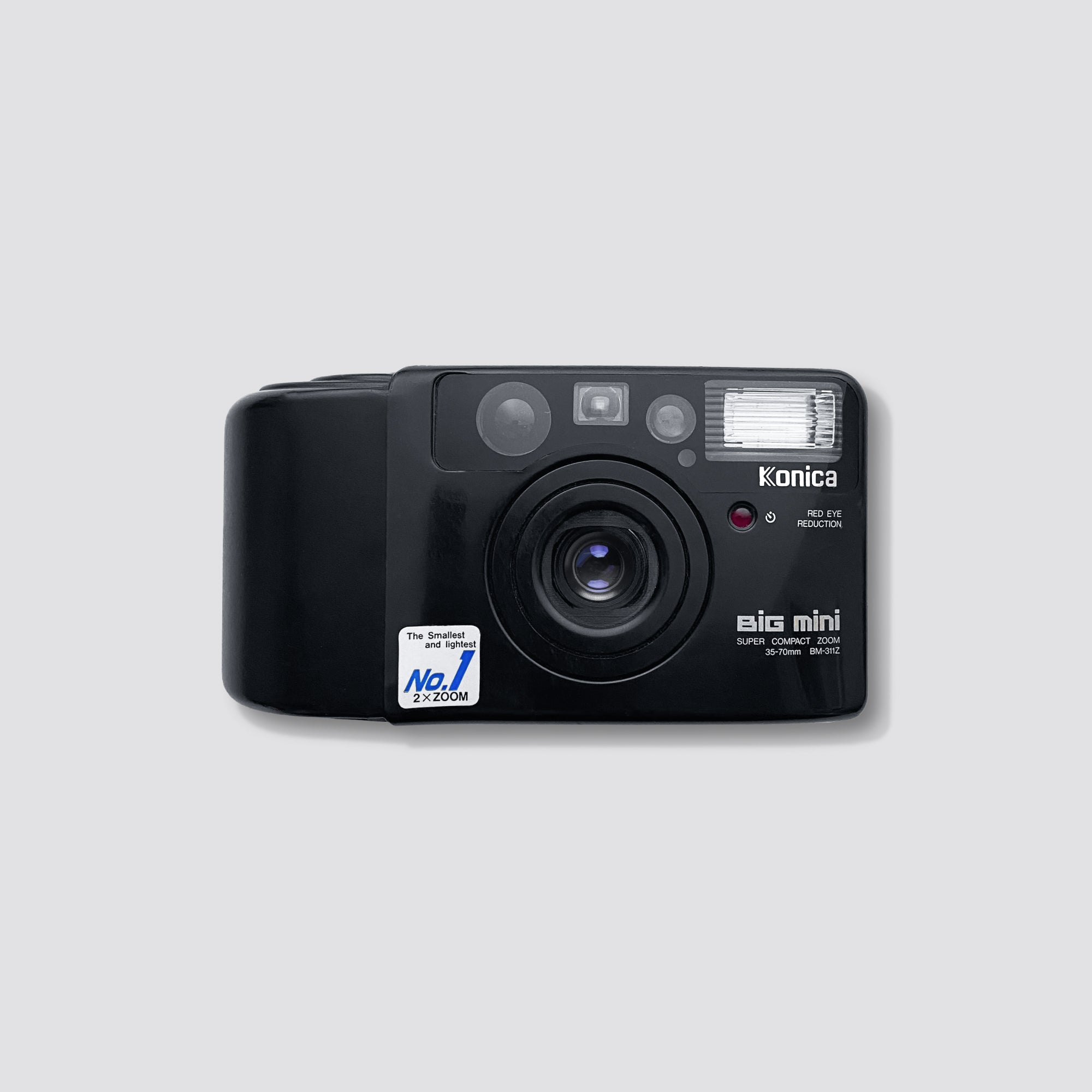 Side angle of the Konica Big Mini BM-311Z showing its compact size and stylish design