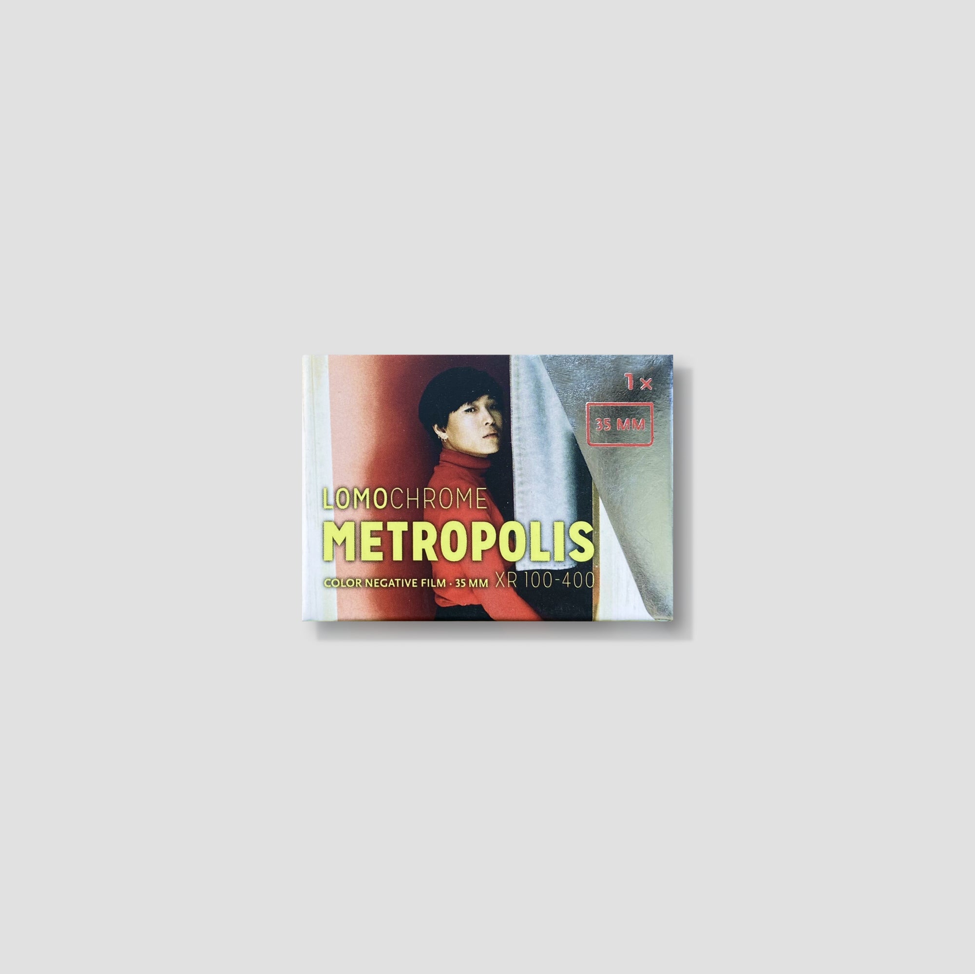 Close-up of LomoChrome Metropolis film roll emphasizing its urban aesthetic.