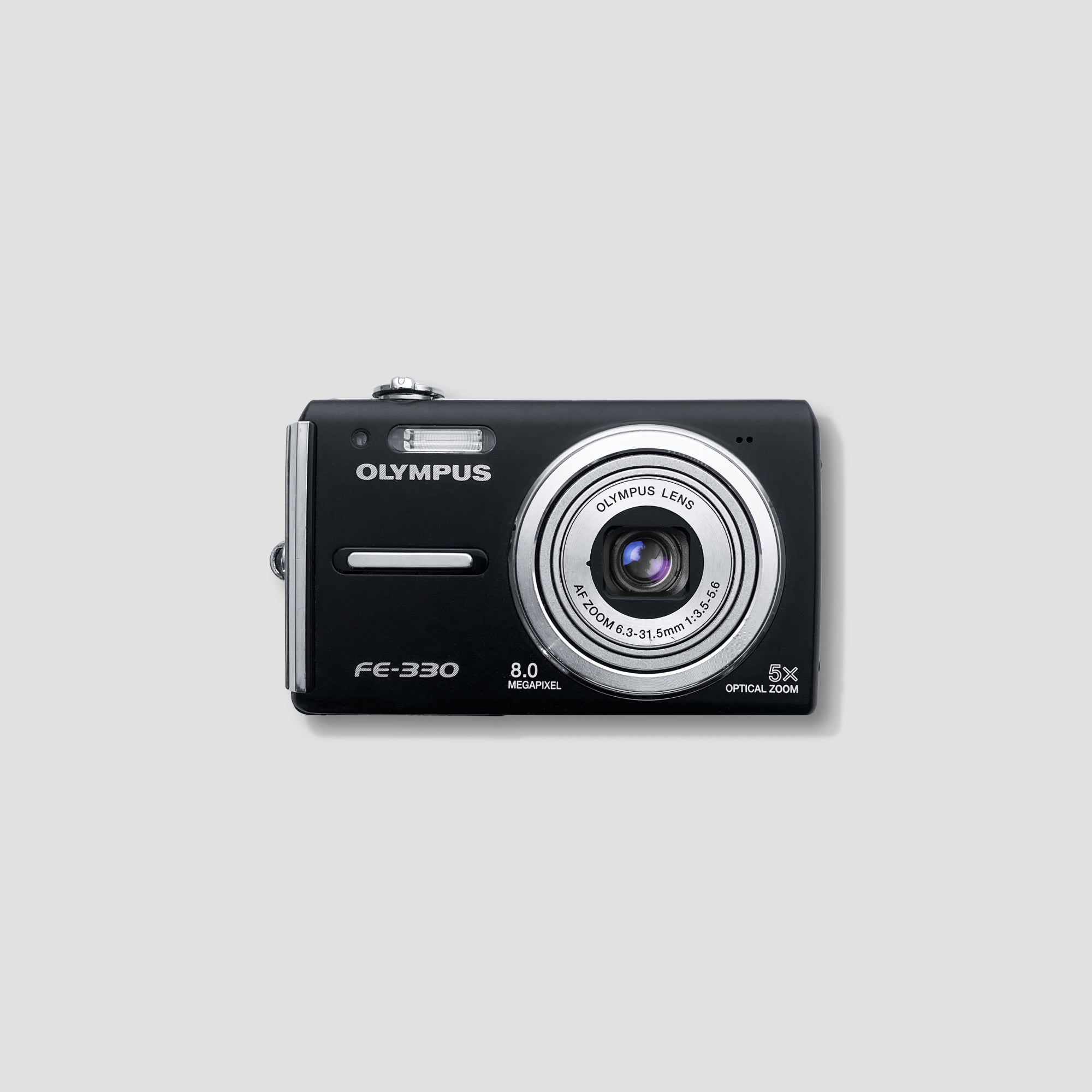 Olympus FE-330 compact digital camera front view showing size and design
