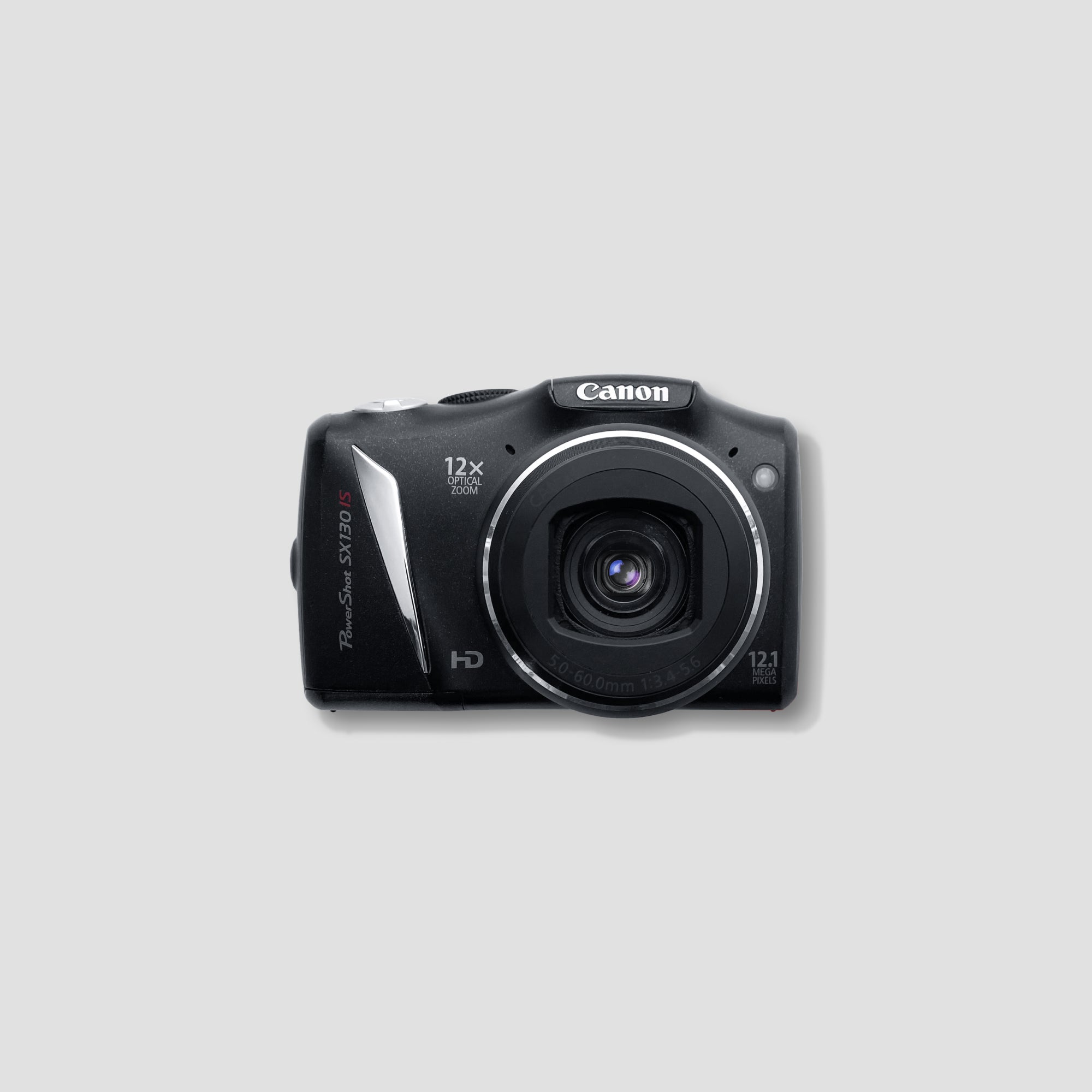 Canon PowerShot SX130 IS showing its 12x optical zoom capability at a scenic viewpoint.