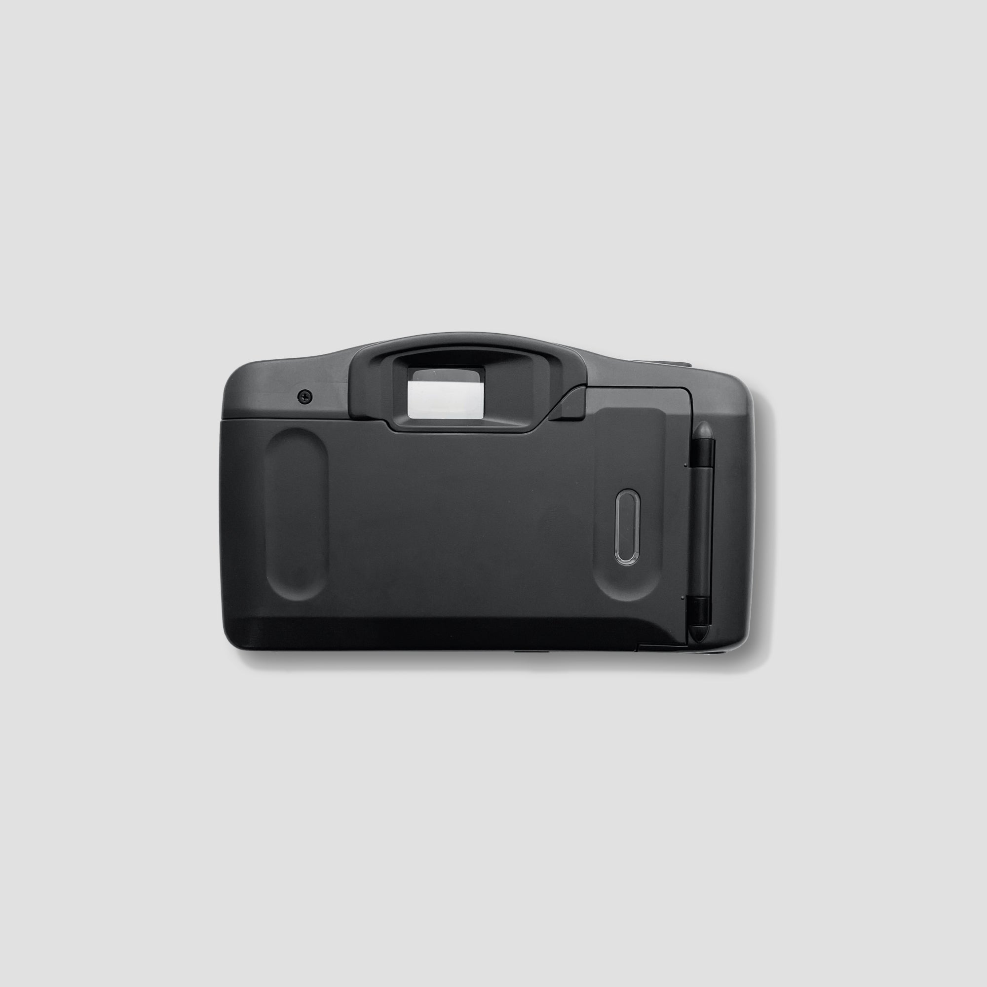 Close-up of the Canon Sure Shot BF lens highlighting its fixed-focus feature.