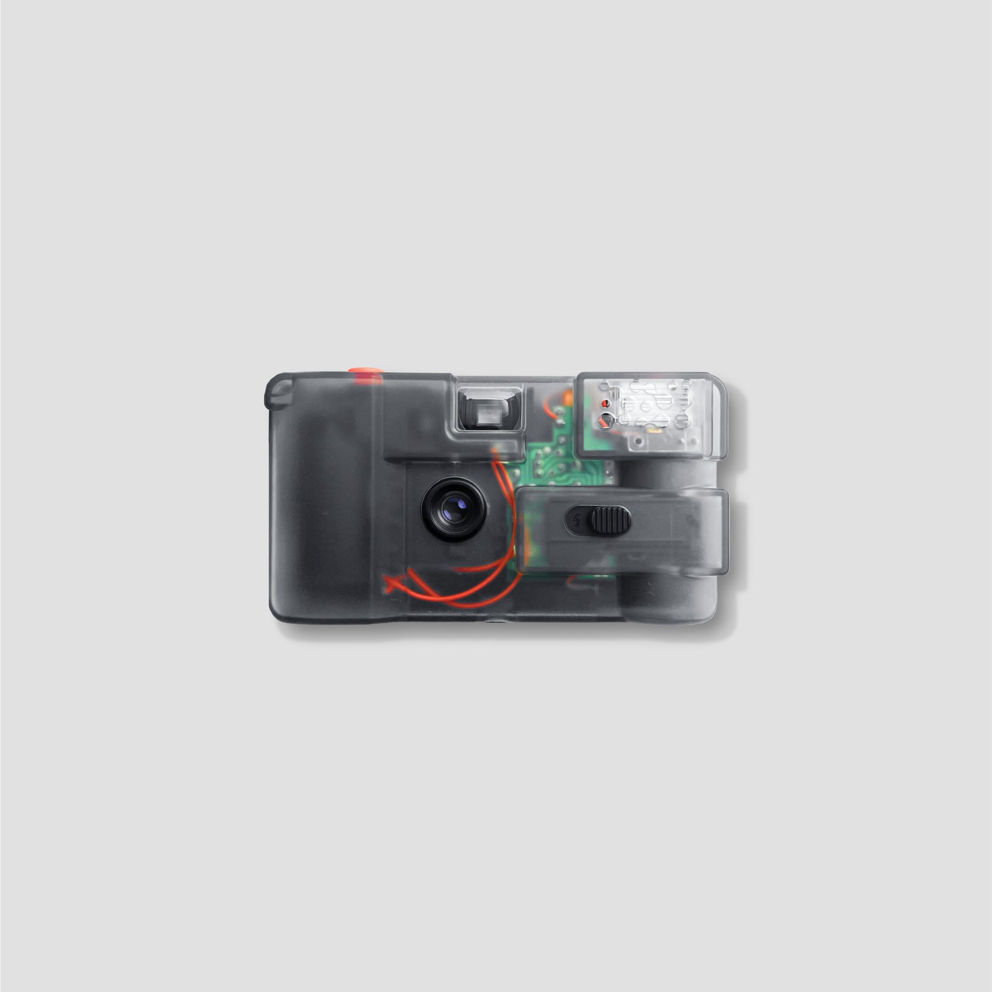 Side view of the compact film camera with transparent shell, showcasing internal mechanics.