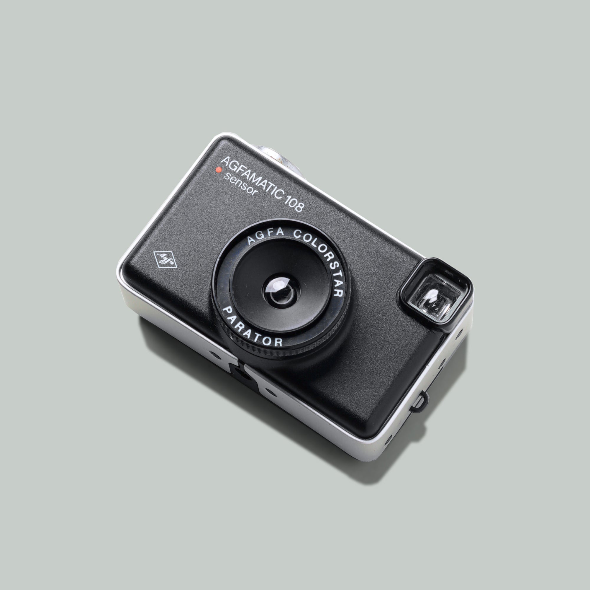 Close-up of Agfa Agfamatic 108 vintage film camera showcasing its design.