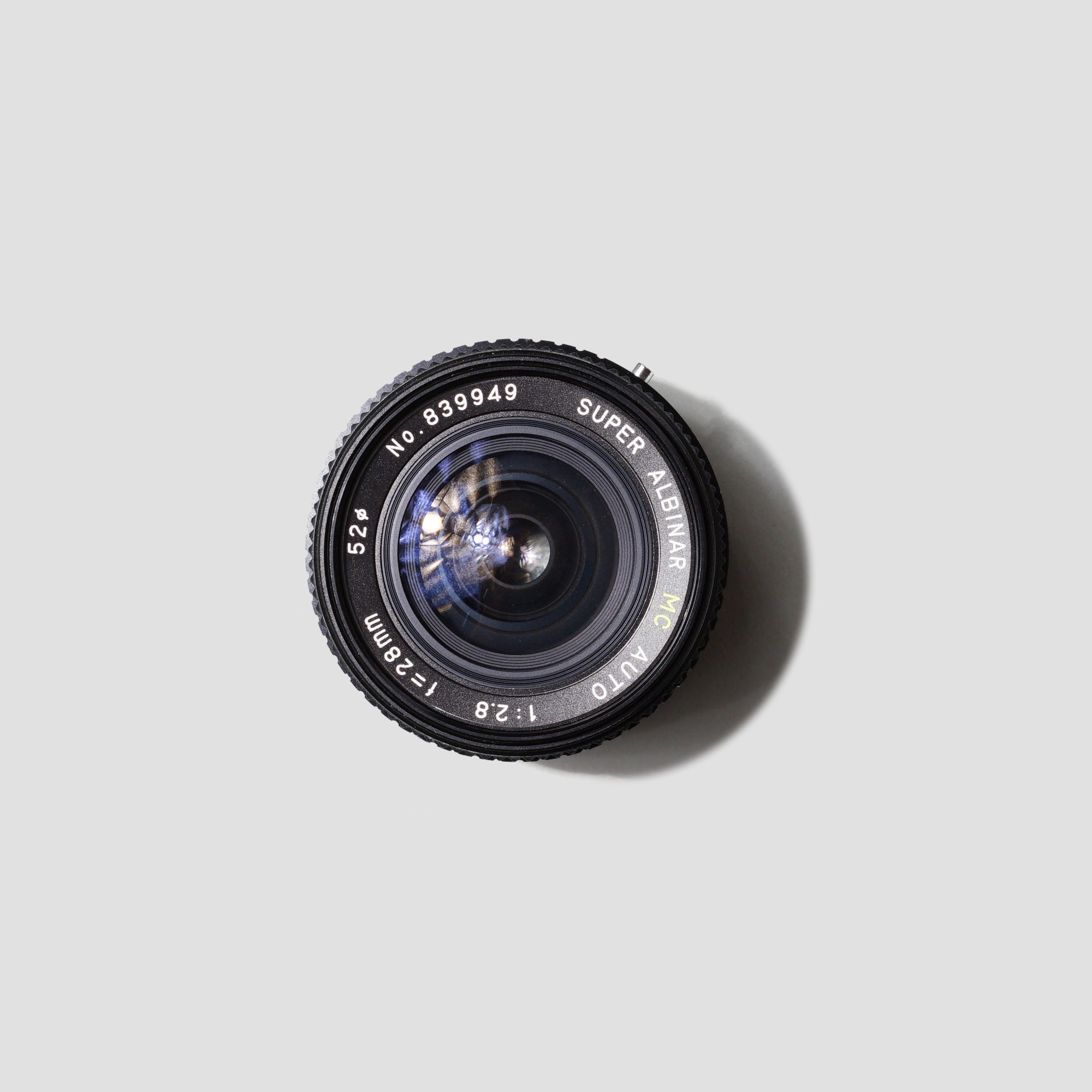 Albinar 28mm f/2.8 wide-angle lens showcasing its compact design.