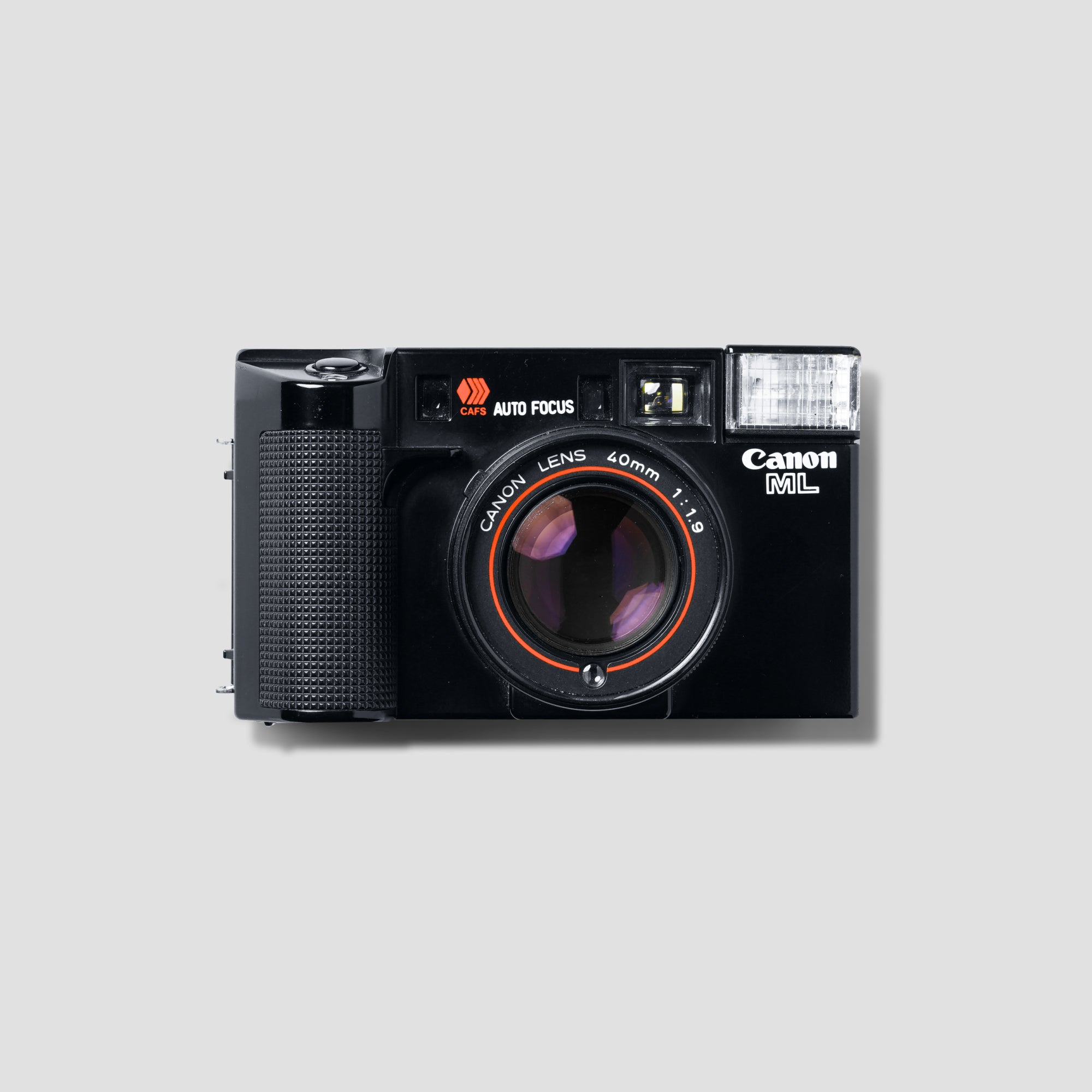 Canon AF35ML vintage film camera showcasing its sleek design and lens for low-light photography.