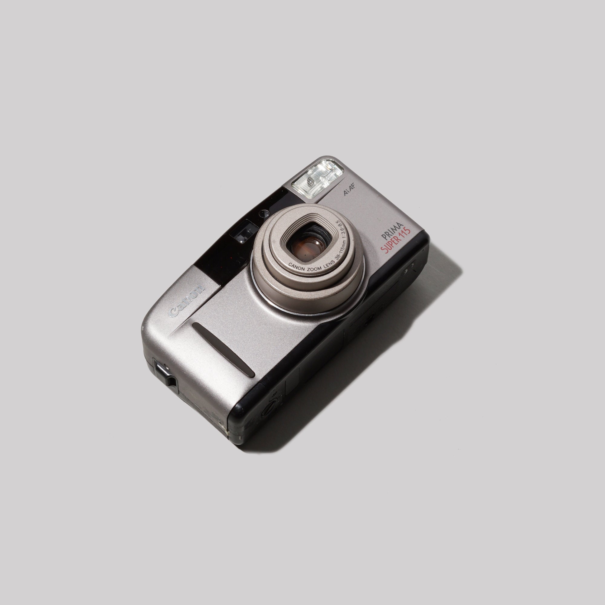 Front angle of Canon Prima Super 115 showing lens and flash