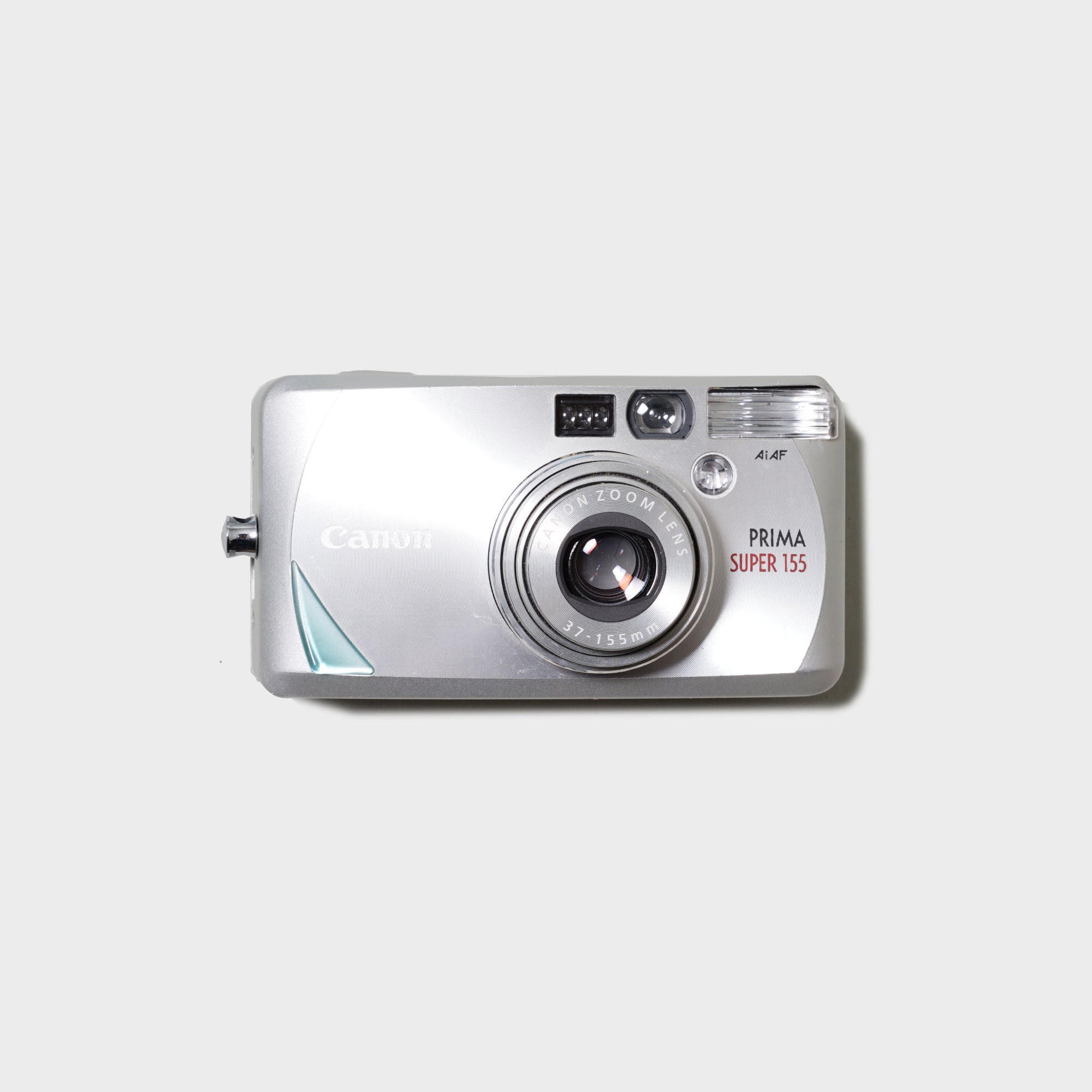 Canon Prima Super 155 compact film camera, showcasing its sleek design and user-friendly features.