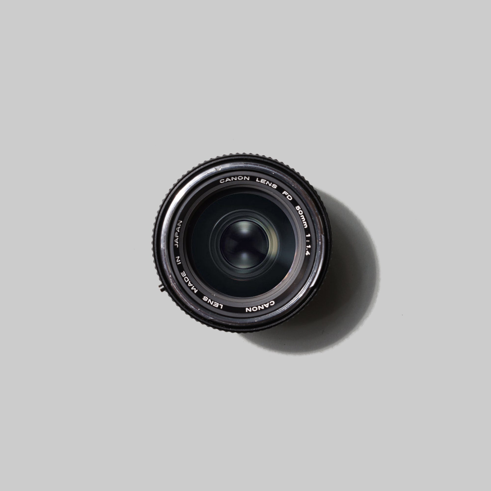 Close-up of Canon FD 50mm 1.4 lens with focus on aperture blades