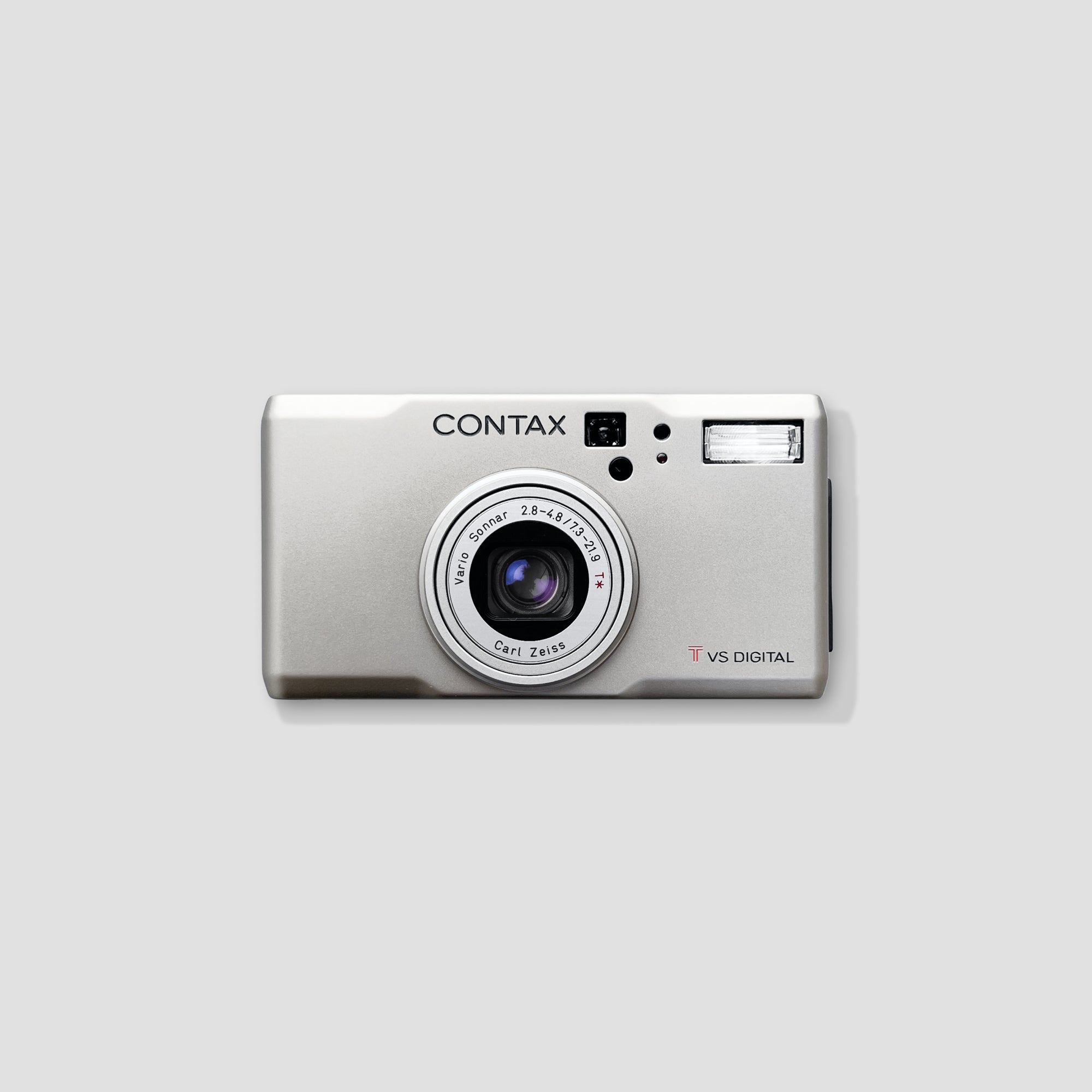 Contax T VS Digital compact camera with Zeiss lens on a table