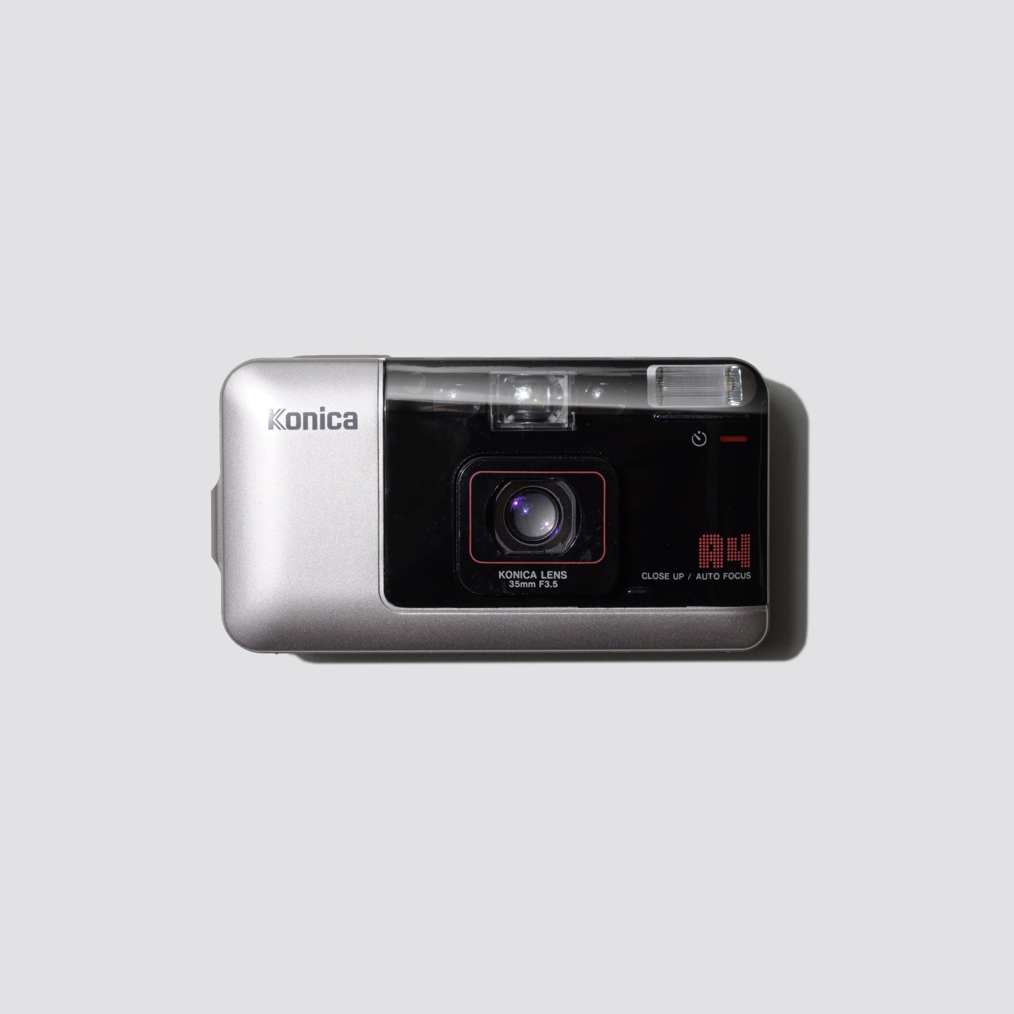 Front view of the Konica Big Mini A4 showing its sleek retro design and lens detail