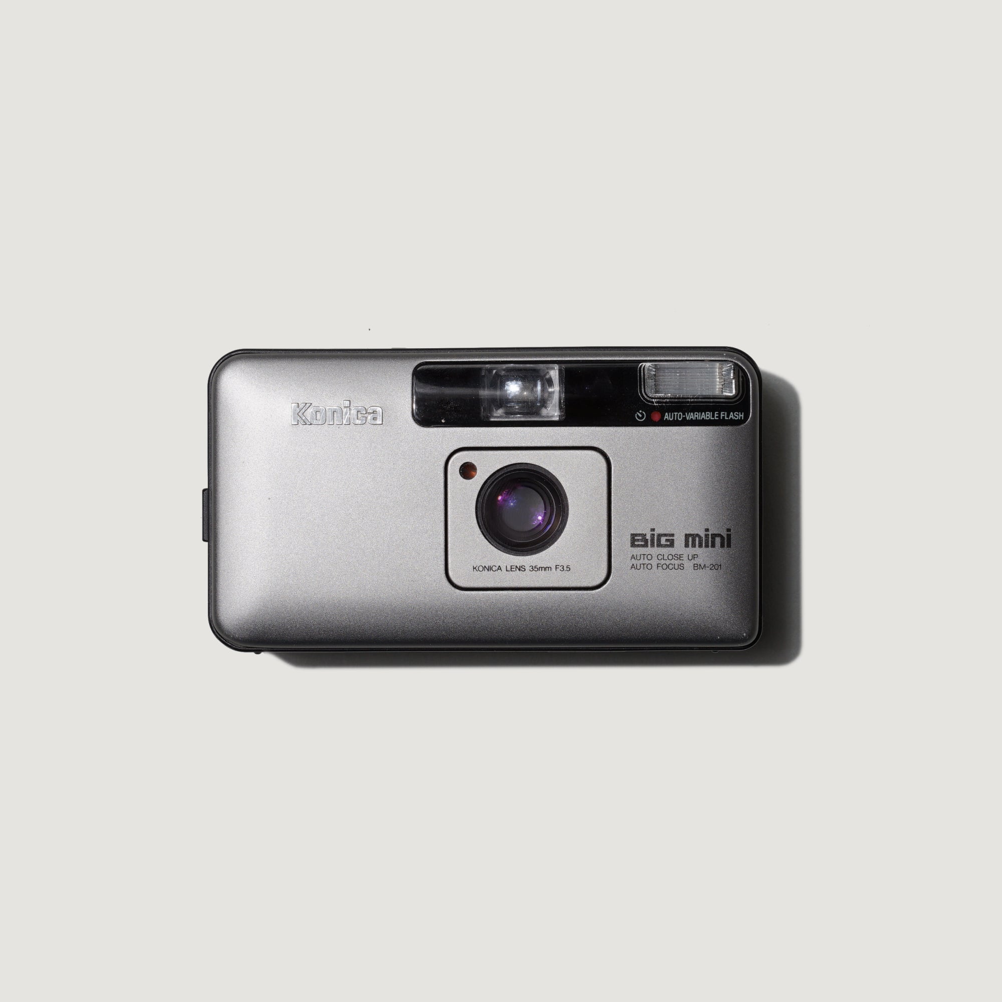 The sleek design of the Konica Big Mini BM-201 point and shoot camera, perfect for street photography.
