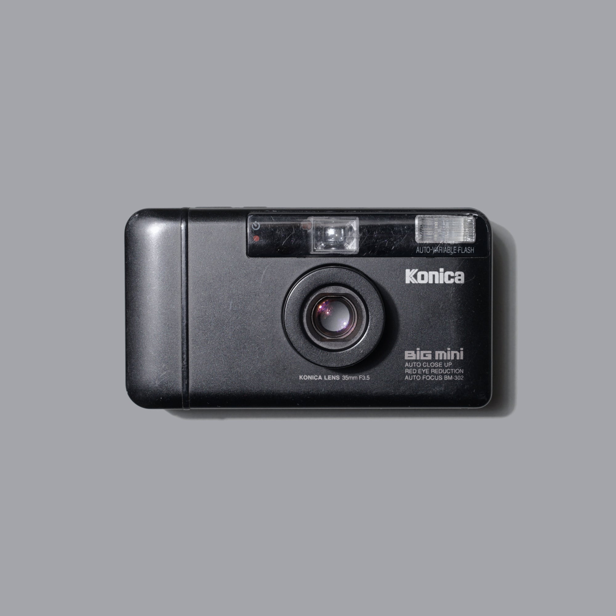 Front view of Konica Big Mini BM-302 compact film camera showing its minimalist design