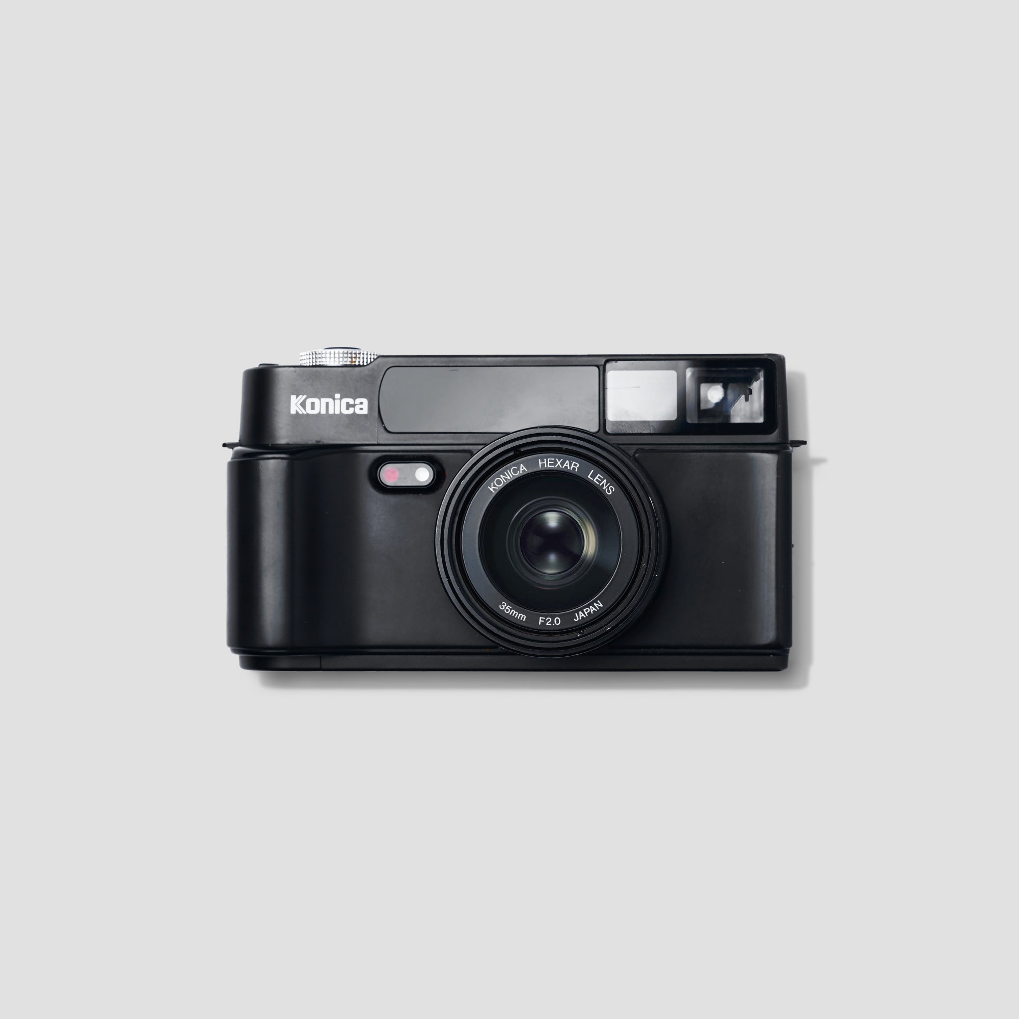 Konica Hexar compact camera showcasing its sleek design and 35mm lens from a slightly angled view.