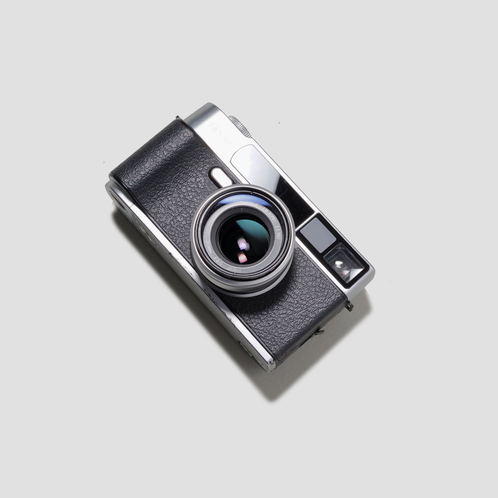 Side view of the limited edition Konica Hexar Gray rangefinder camera showcasing its sleek design.