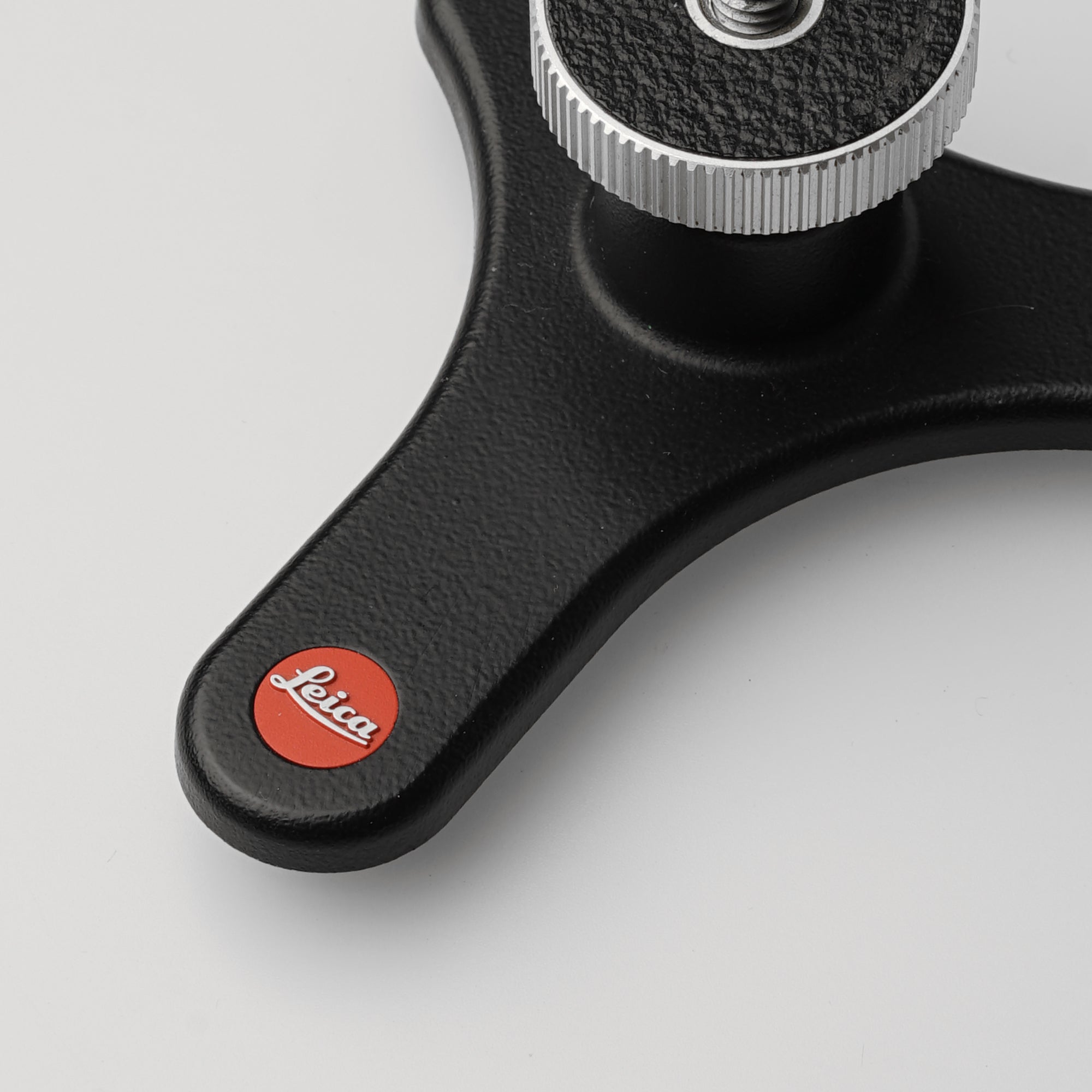 Close-up of the Leica mini tripod showcasing its sturdy build and compact design.