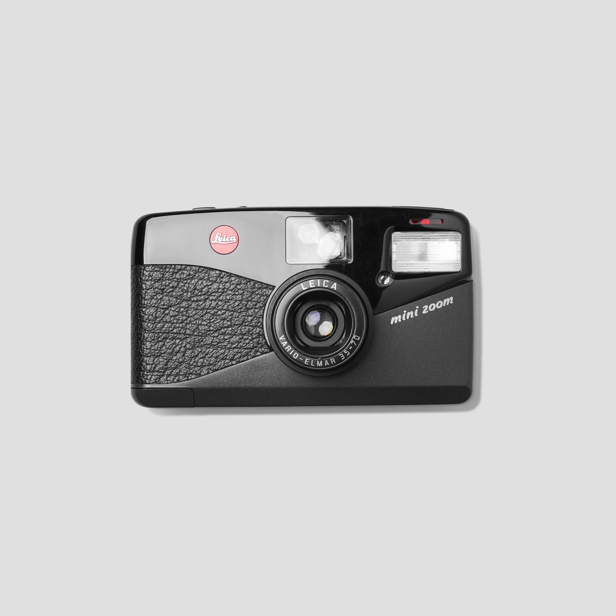 Front view of the Leica Mini Zoom, highlighting its compact design and user-friendly controls.