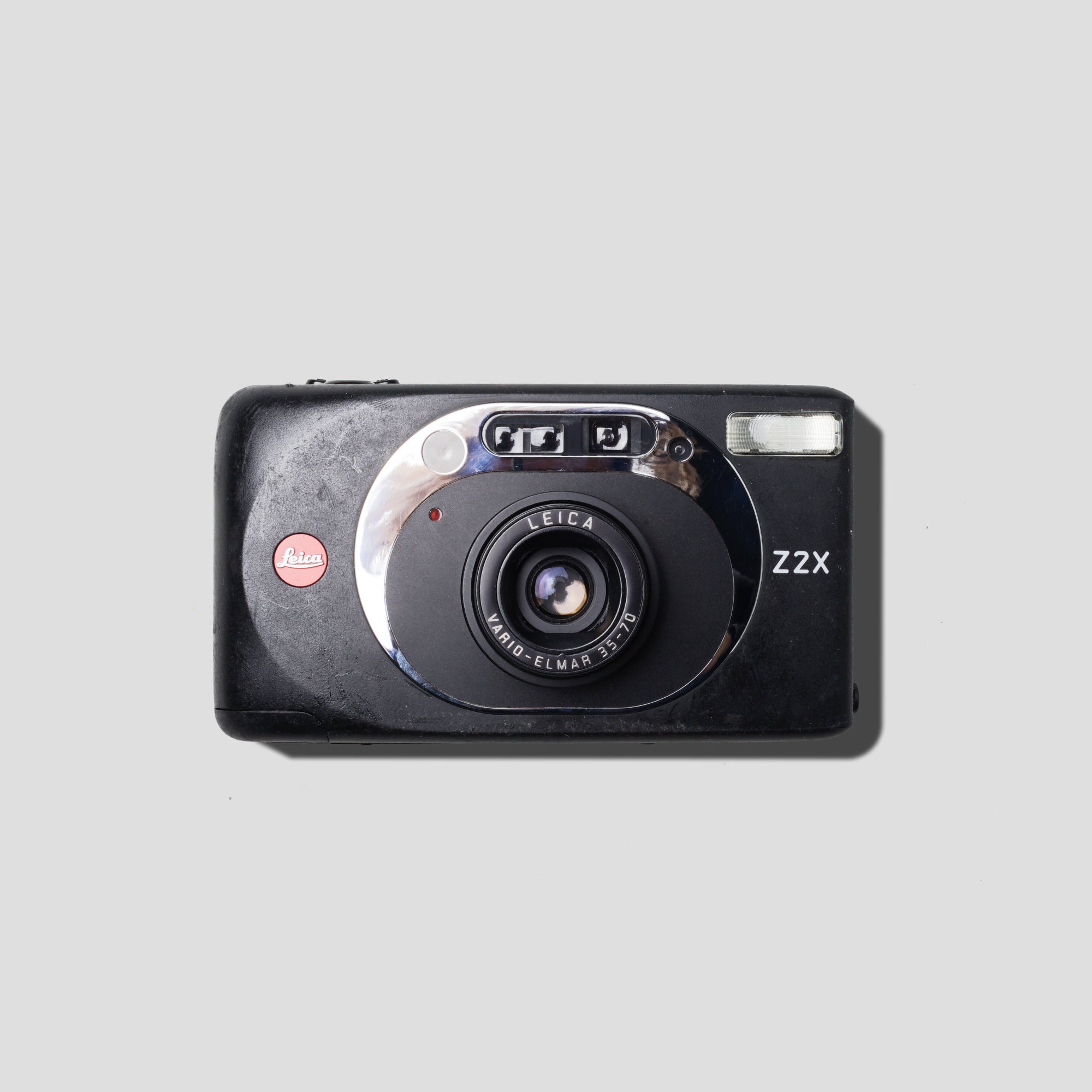 Leica Z2X Black camera front view highlighting its sleek design and lens.