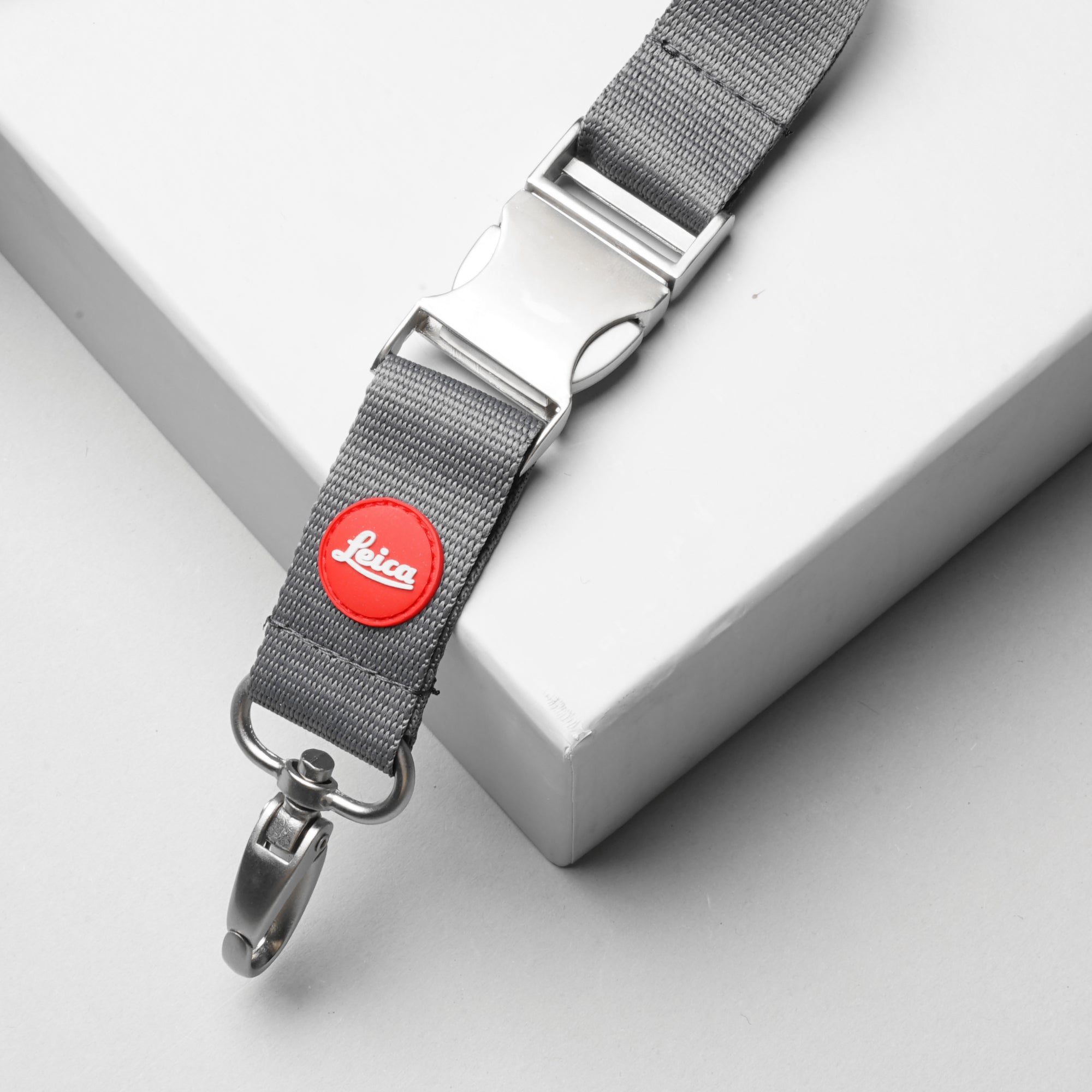 Leica keychain hanging on a set of keys, showing detailed logo and craftsmanship