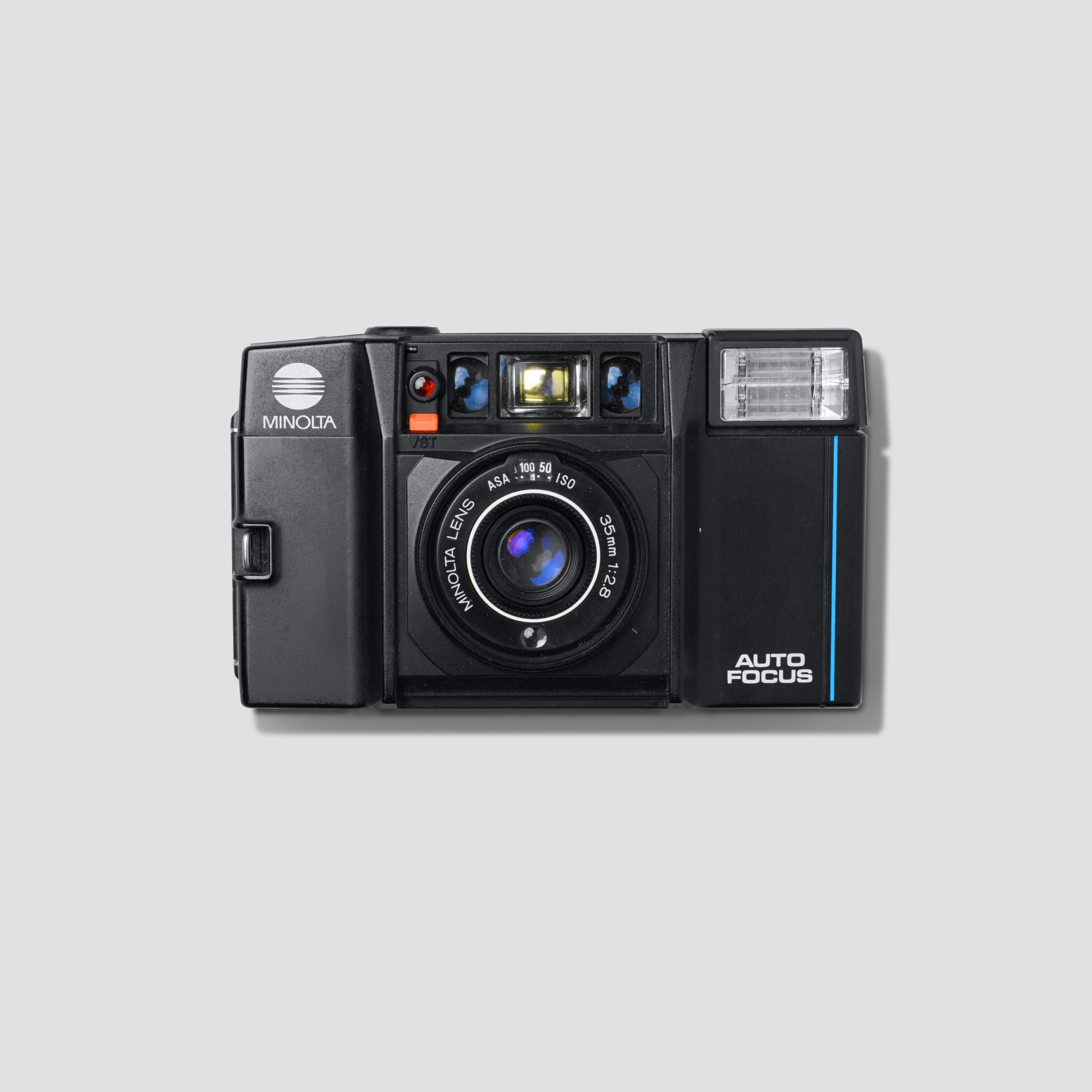 Close-up of Minolta AF-S camera body showcasing retro design and lens