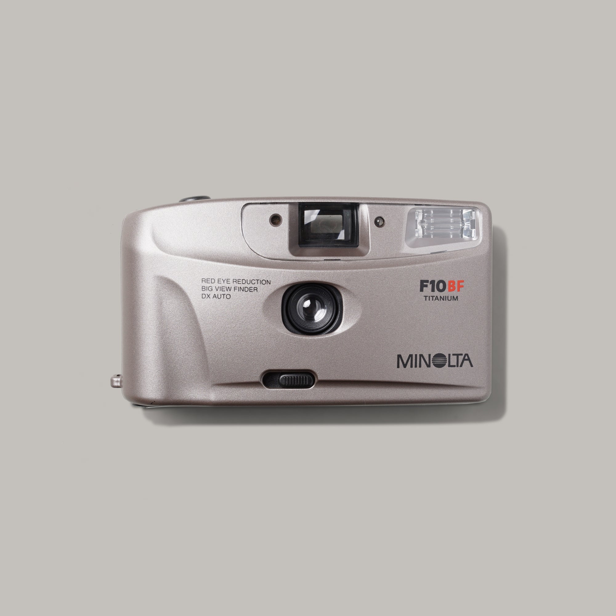 Close-up of Minolta F10BF viewfinder camera showing its compact design