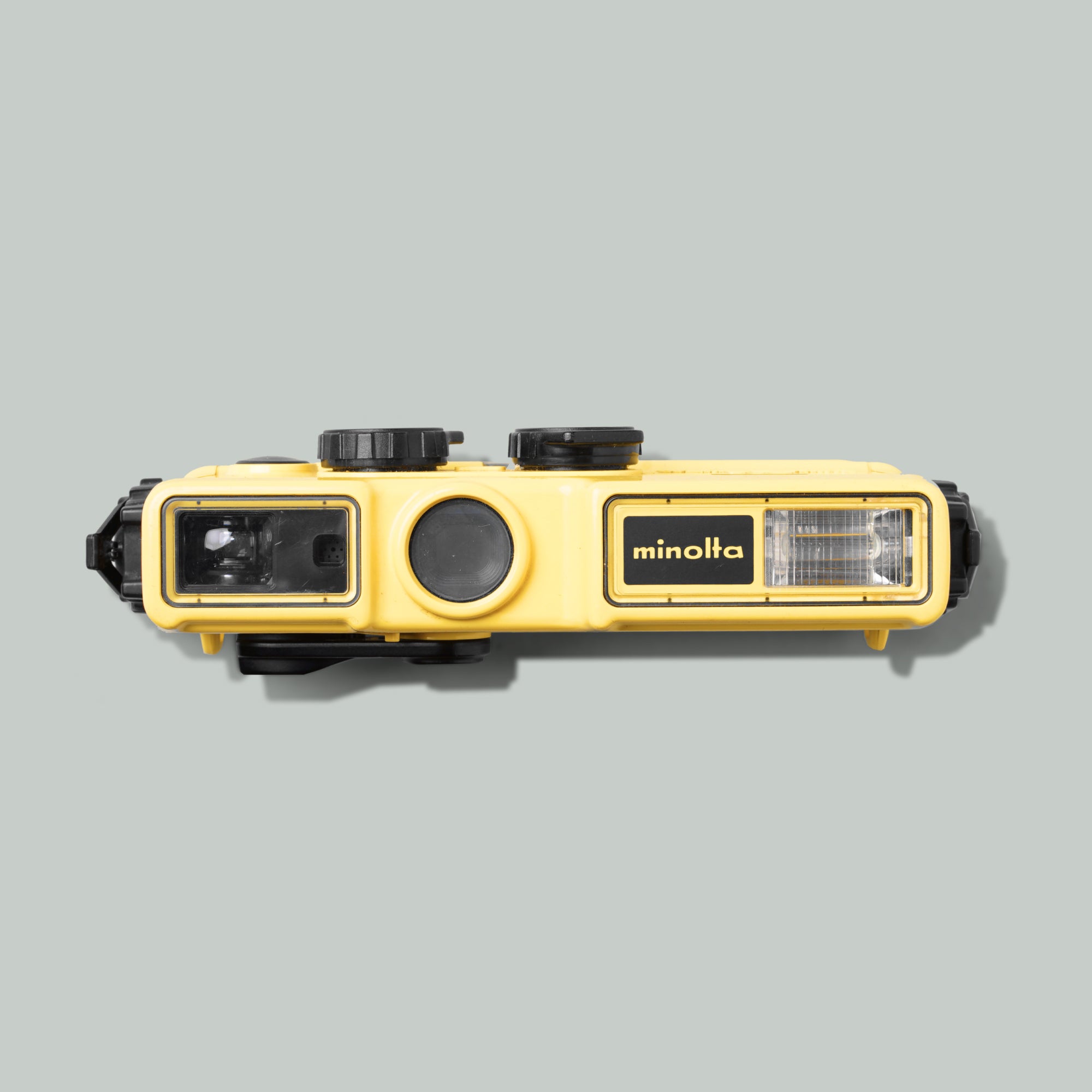 Close-up of AquaSnap waterproof pocket camera submerged in clear water