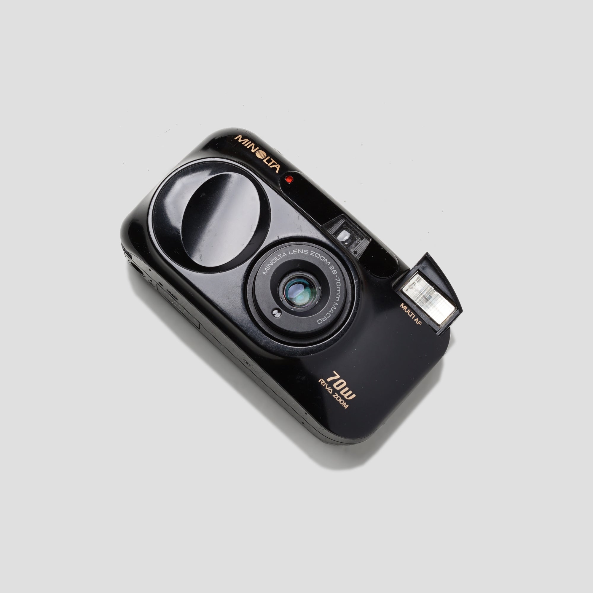 Front view of the Minolta Riva Zoom 70w showing its compact design and zoom lens