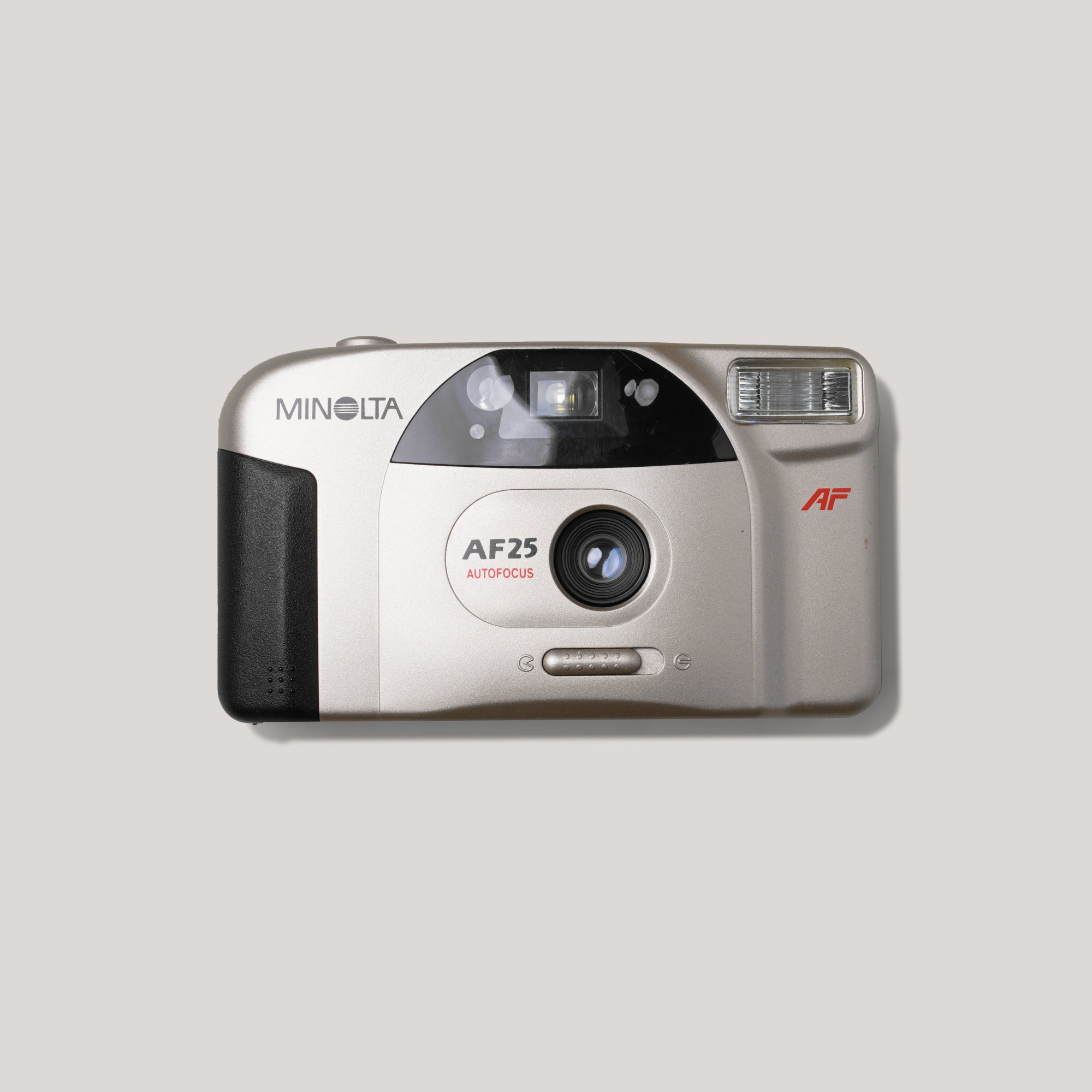 Close-up of Minolta AF25 compact film camera with 35mm lens