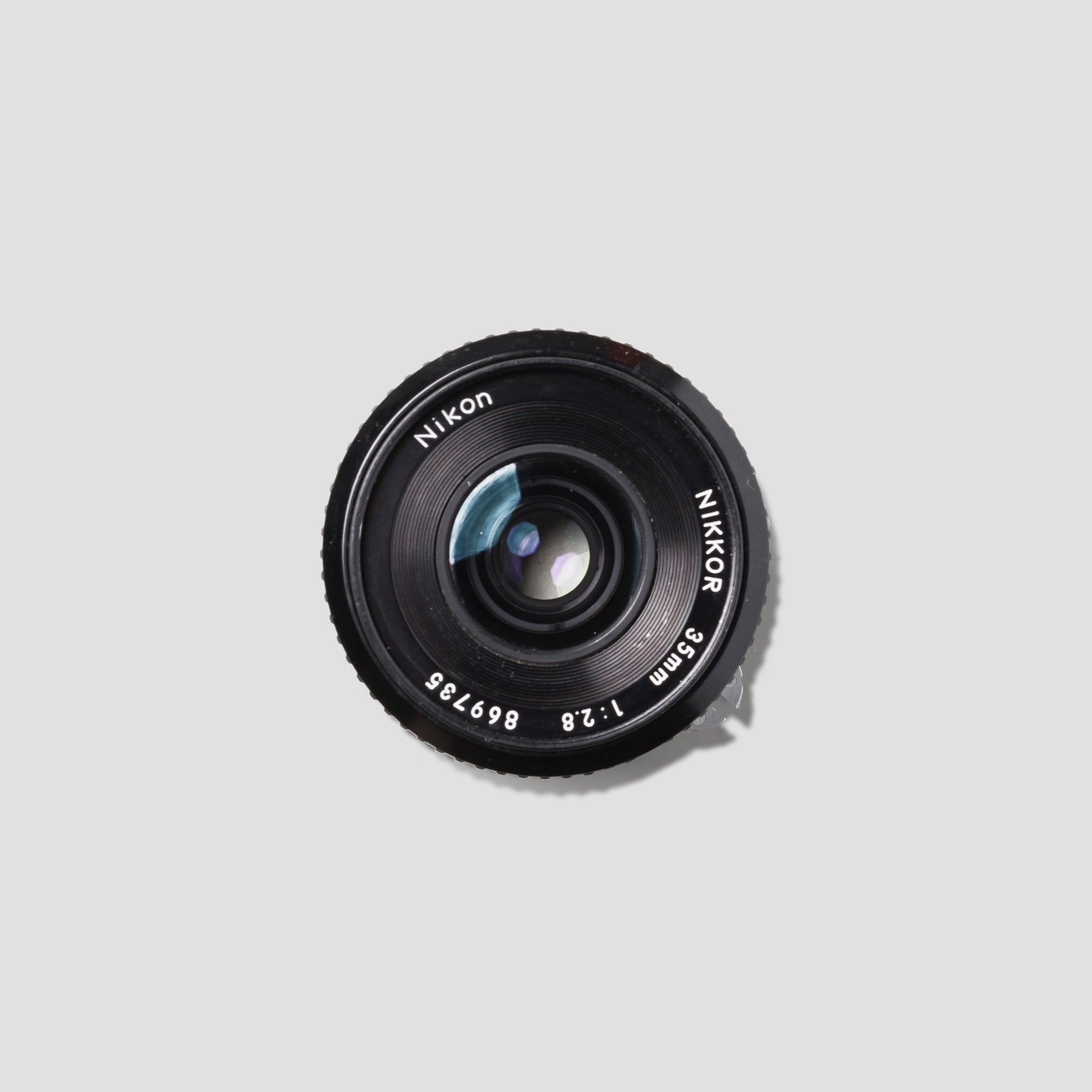 Nikon Nikkor 35mm f/2.8 lens showing sharp focus on a cityscape during sunset.