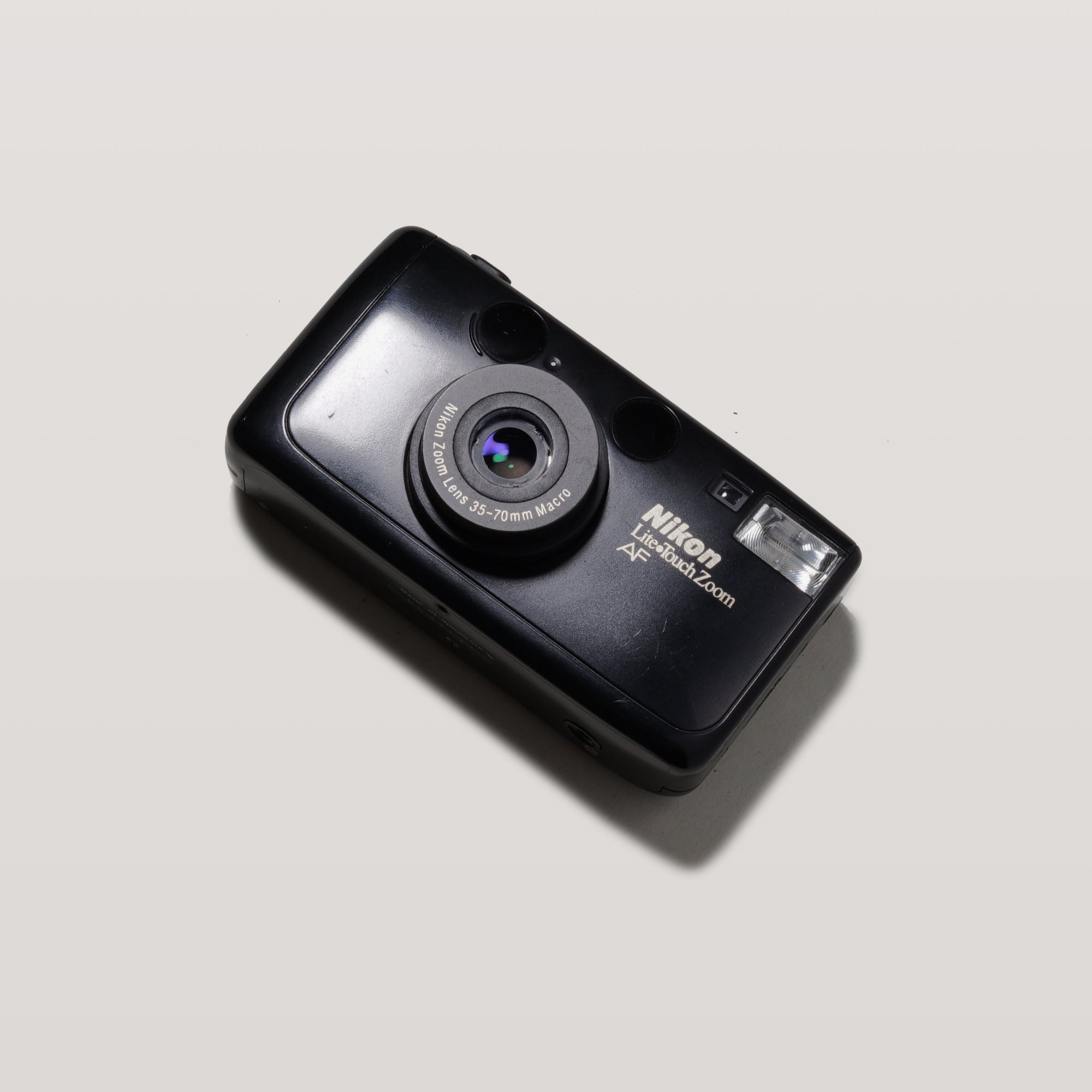 Nikon Lite Touch Zoom AF 35mm film camera showing sleek matte black design