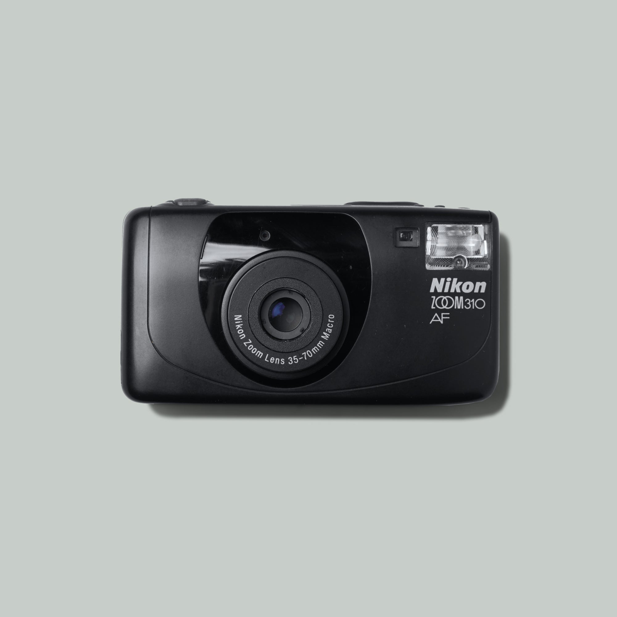 Close-up of Nikon Lite Touch Zoom 70 film camera with macro lens