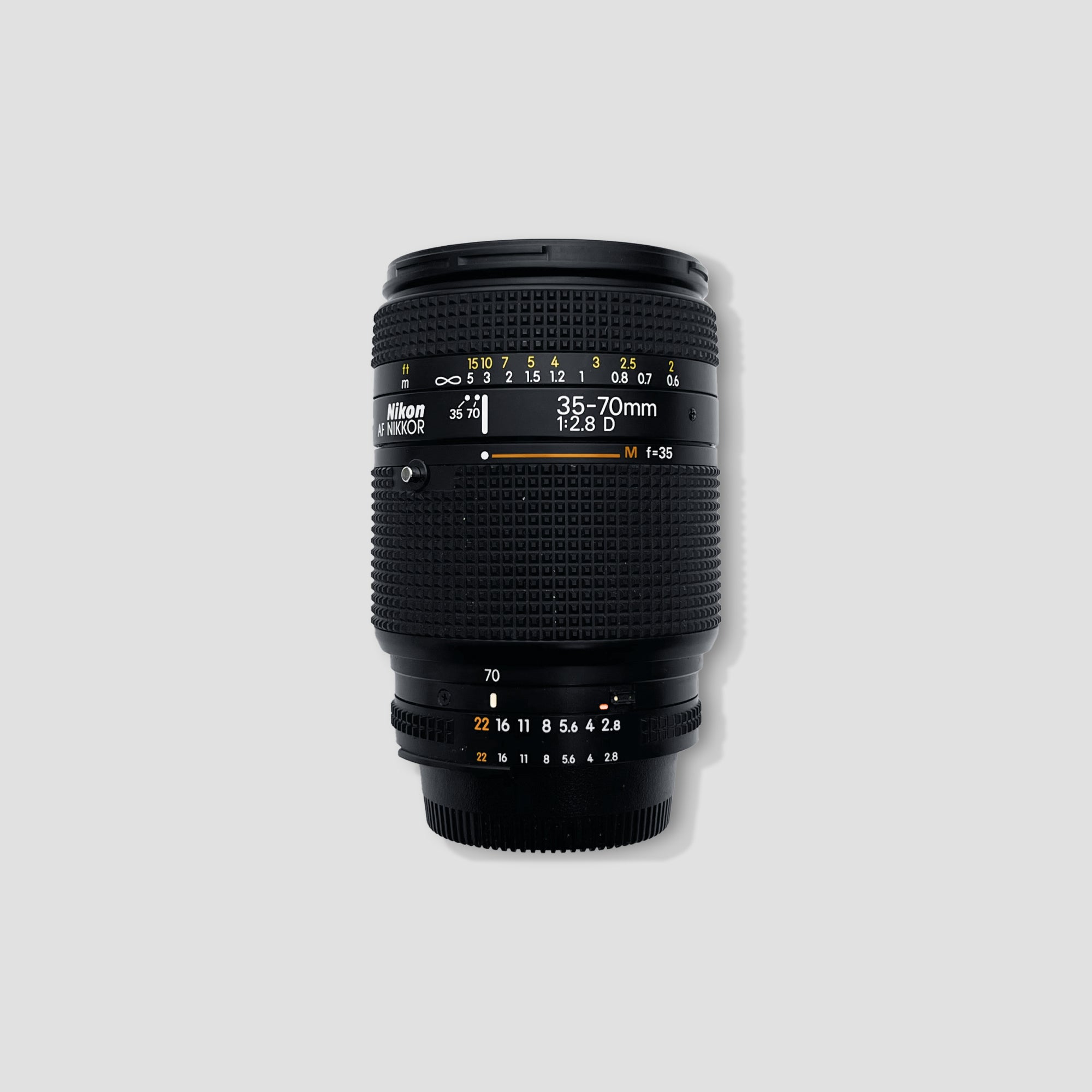Close-up of Nikon AF Nikkor 35-70mm lens highlighting its zoom feature and build quality.