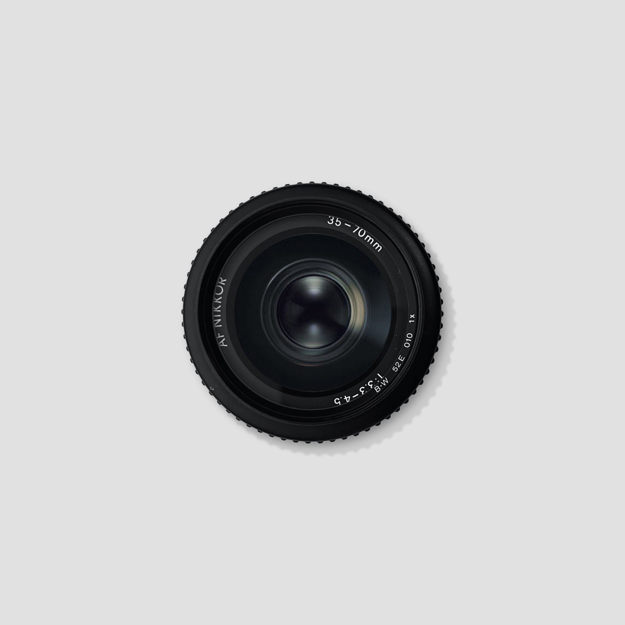 Nikon AF Nikkor 35-70mm lens from the front angle showing zoom range