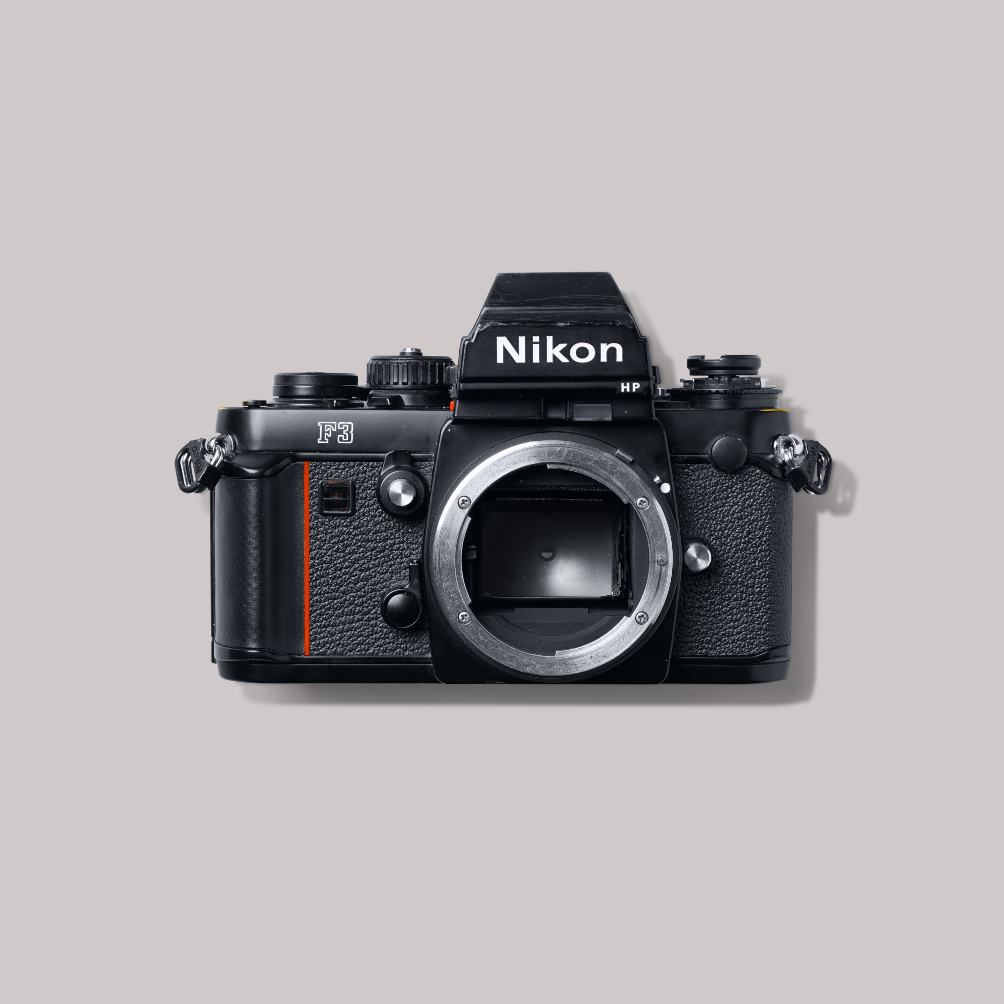 Nikon F3 High Point film camera with DE-3 finder, showcasing its elegant design and functionality for photographers.