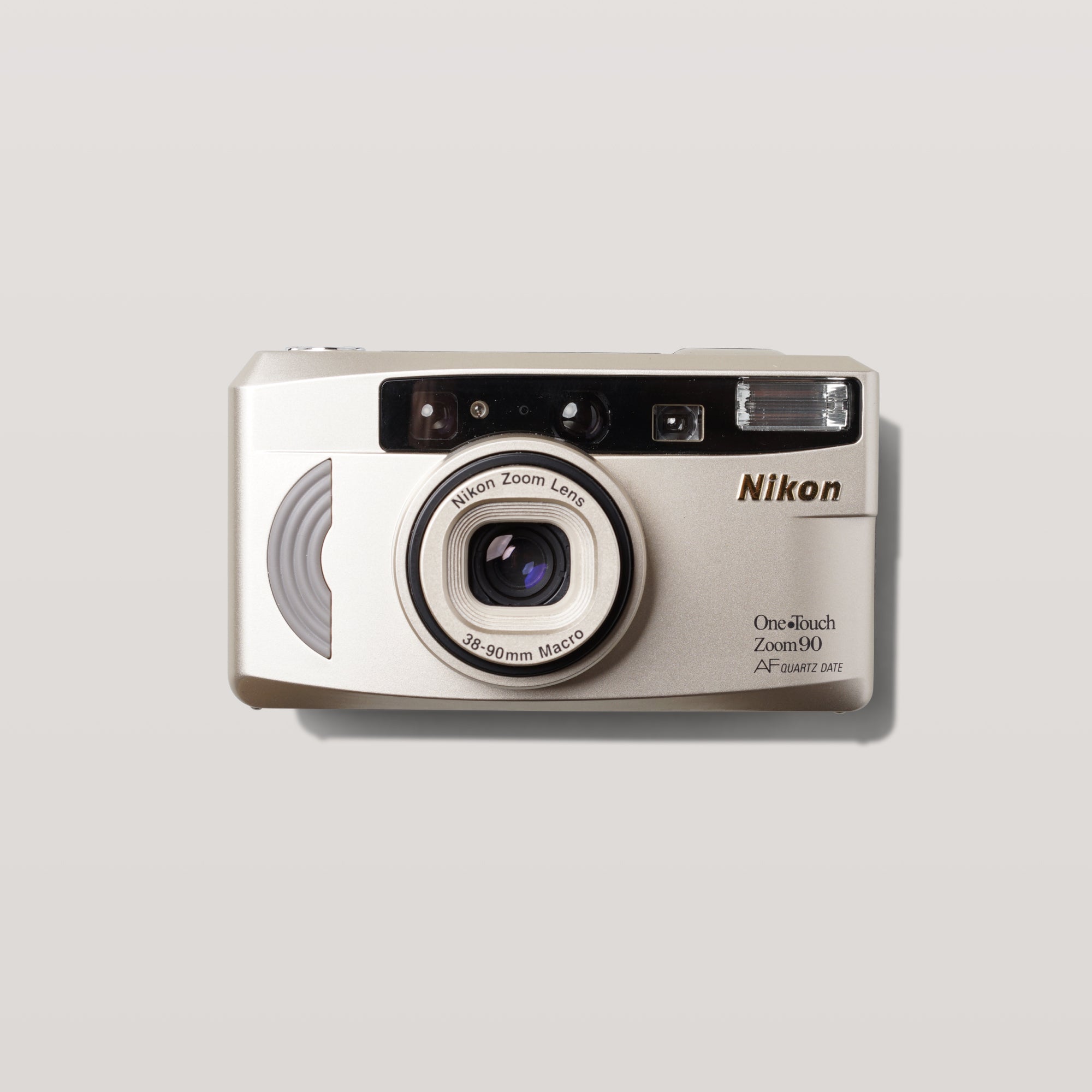 Nikon Quartz Date 90 Zoom camera showcasing its compact design and zoom lens, perfect for on-the-go photography.