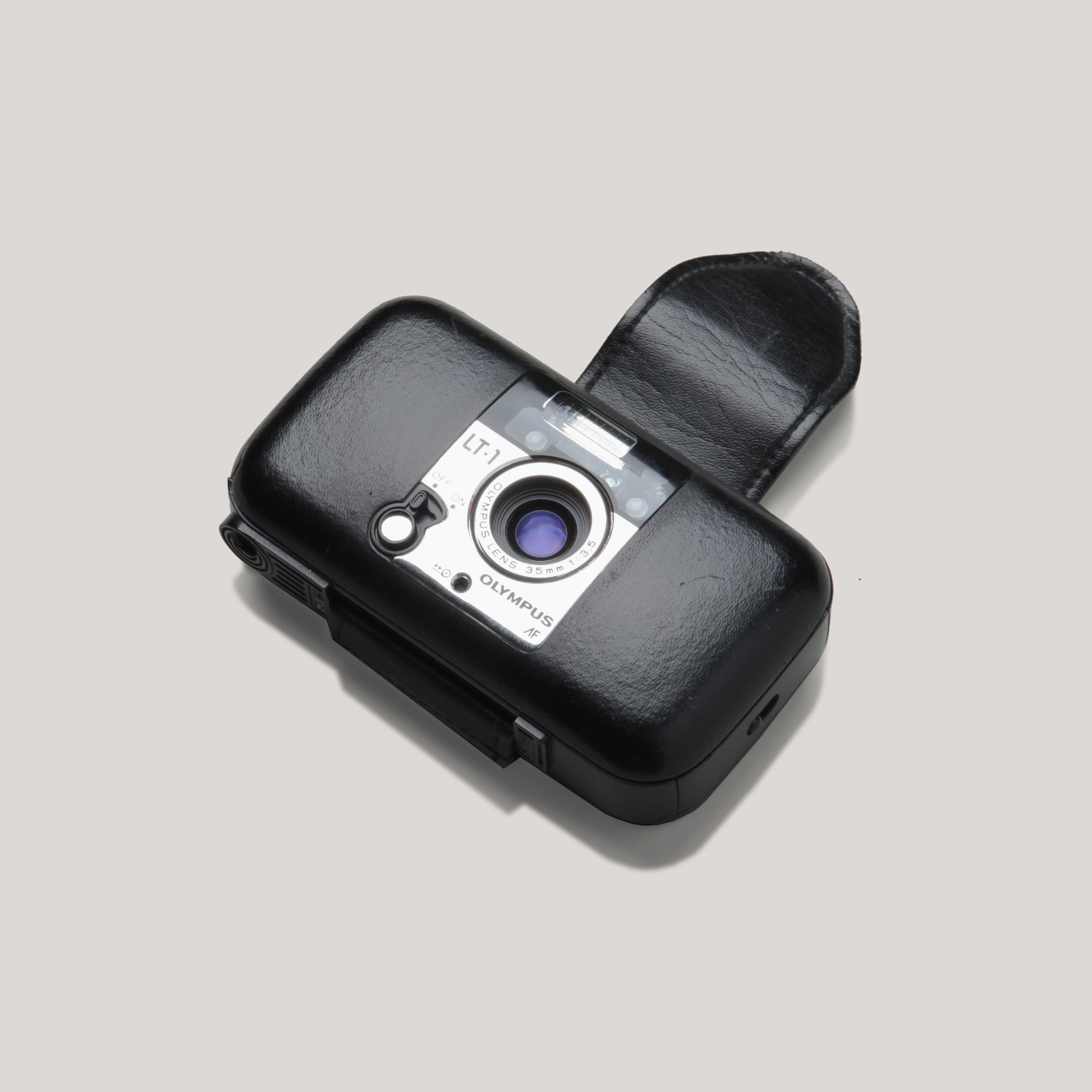 Olympus LT-1 designer point and shoot camera with leather finish, perfect for travel photography.