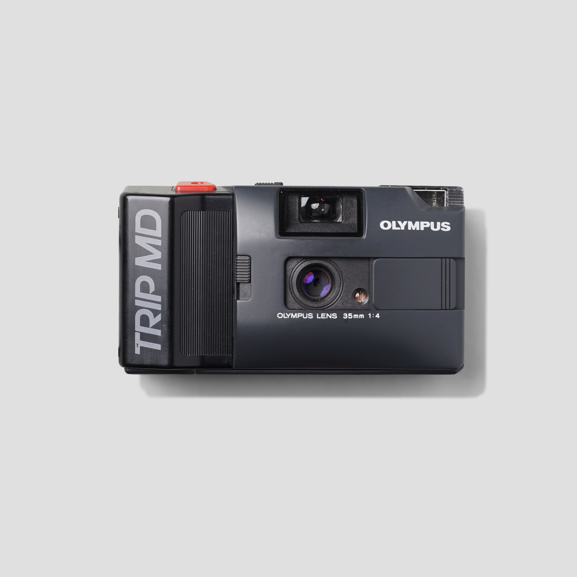 Olympus Trip MD compact 35mm film camera front view with vintage design