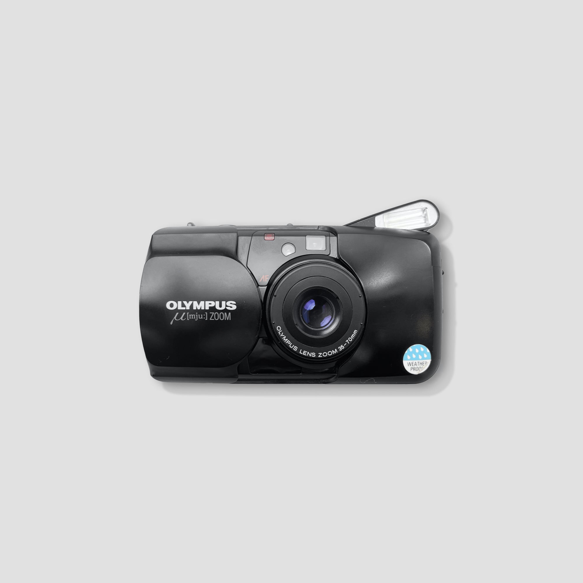 Olympus MJU Zoom compact digital camera from the front, showcasing its sleek design and easy-to-use controls
