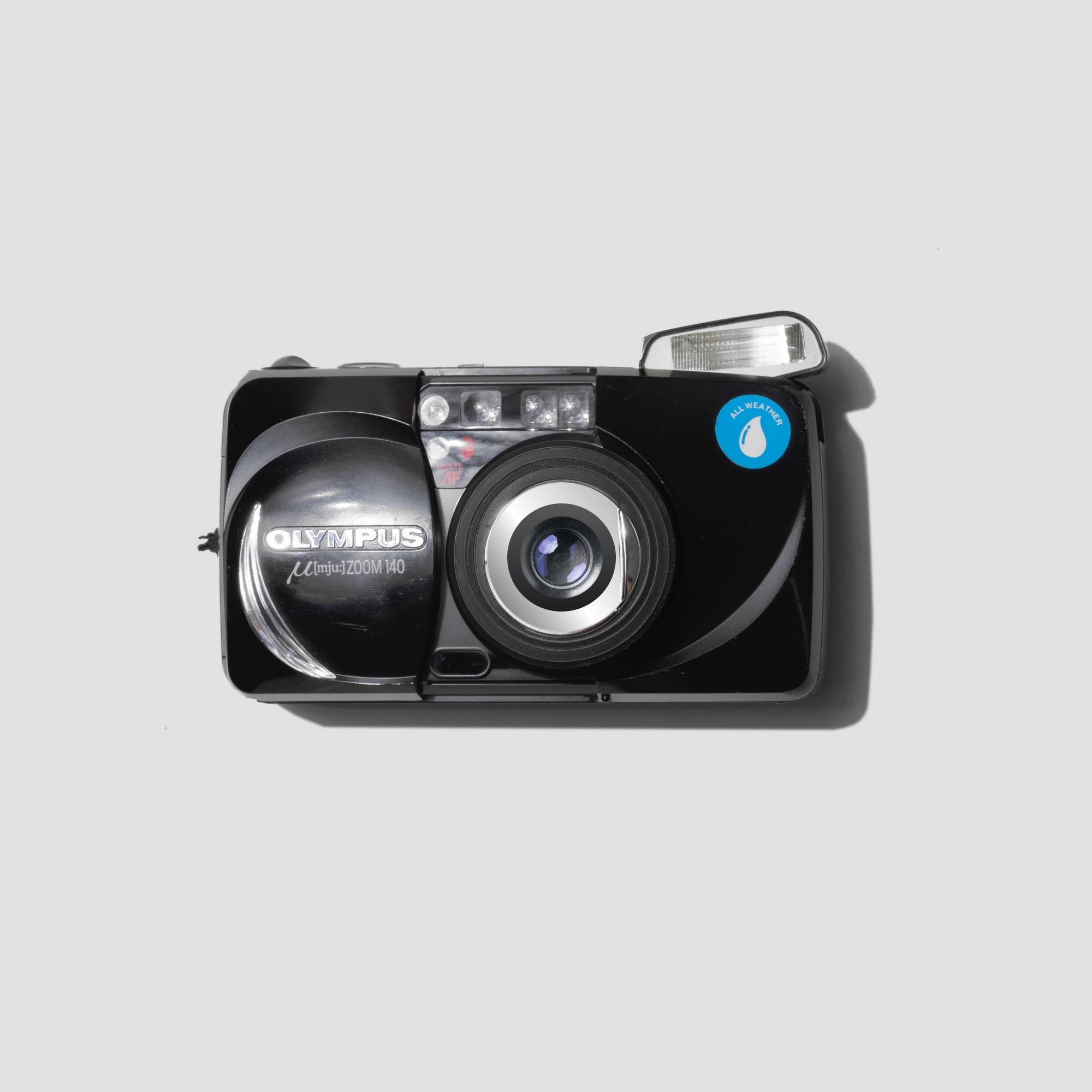 Olympus MJU Zoom 140 compact zoom camera showcasing its sleek design and weatherproof features.