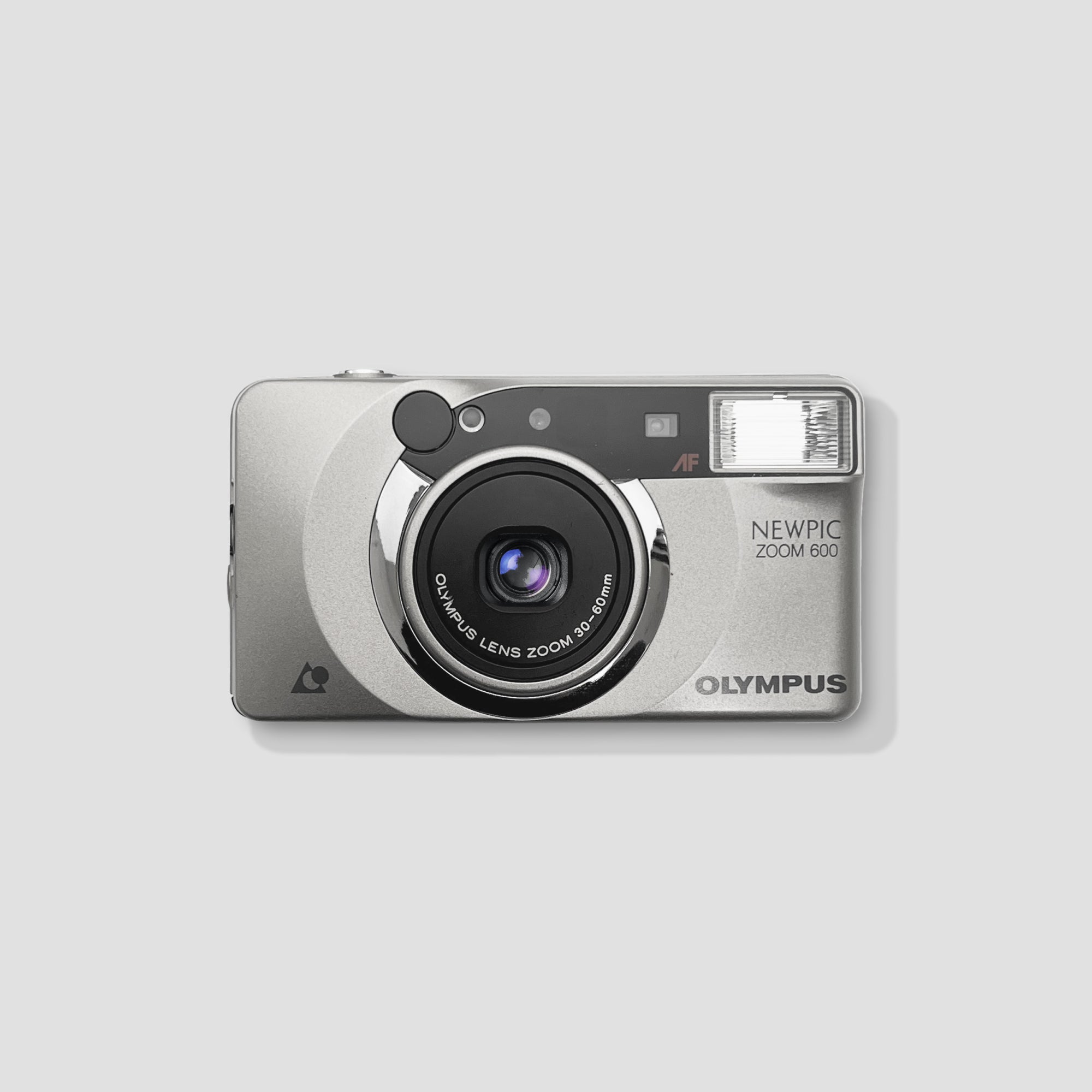 Close-up of Olympus Newpic Zoom 600 with zoom lens and compact design