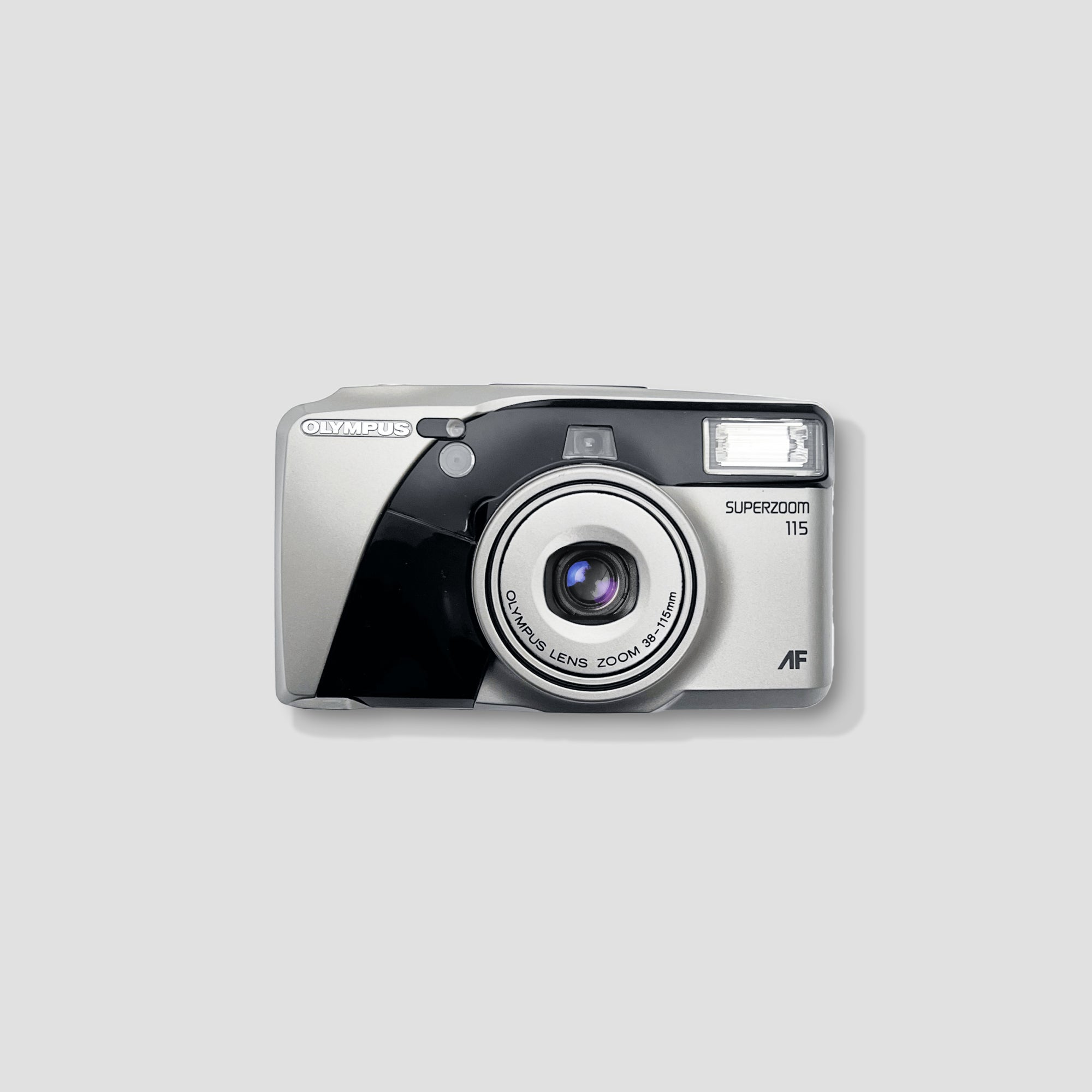 Olympus Superzoom 115 camera with zoom lens ready for travel photography